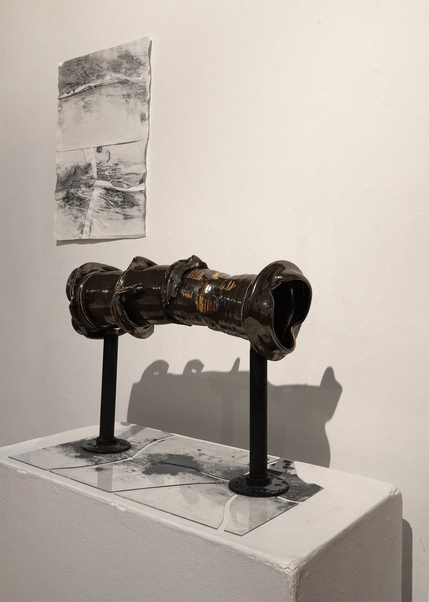 Left- Watercourse, 2026, iron oxide on paper, 17” x 12”
Right- Oilcourse, 2026, ceramic, iron, glass, iron oxide, 17” x 13”
