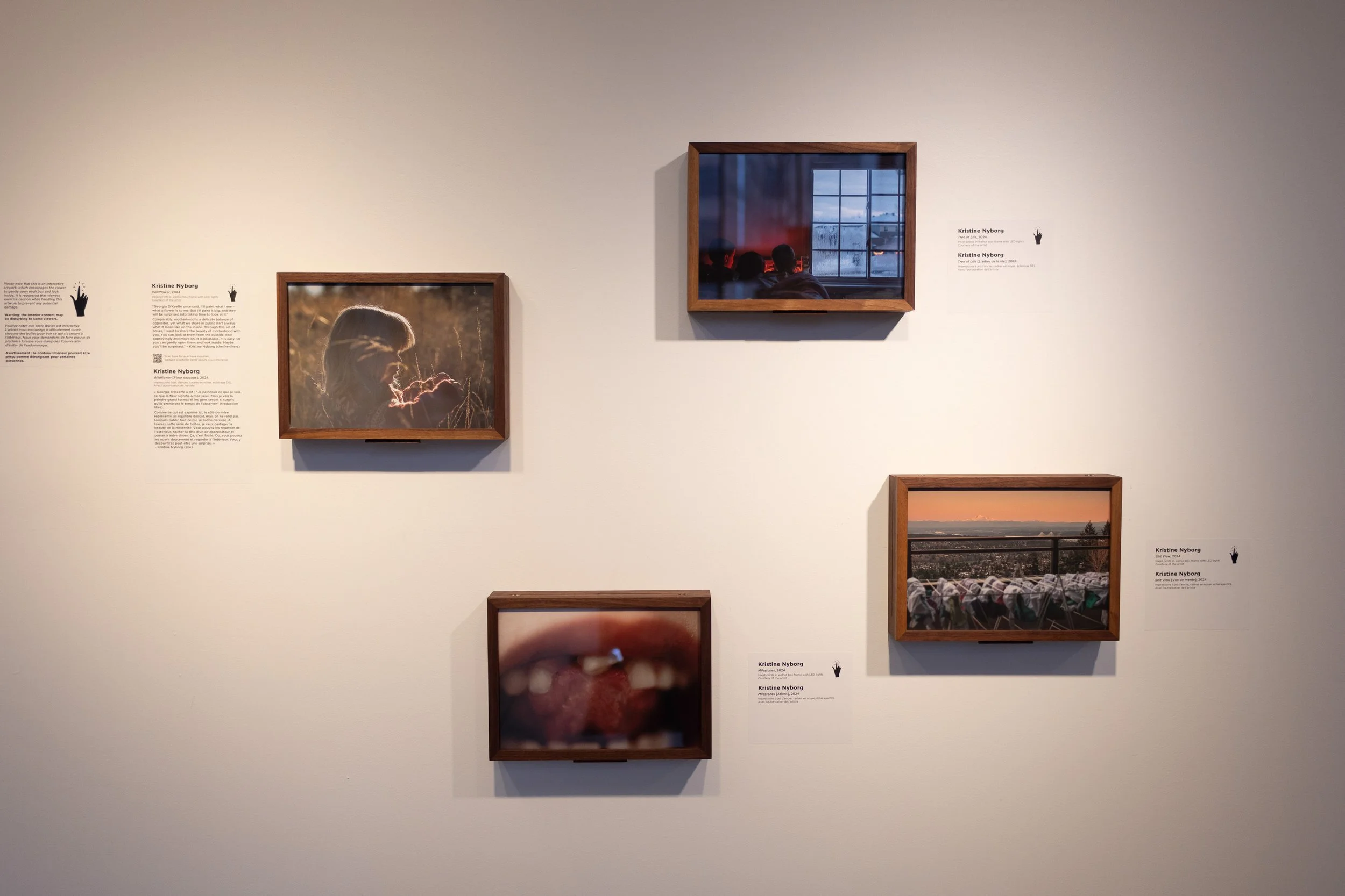 Photos by Kristine Nyborg handing on a wall. 