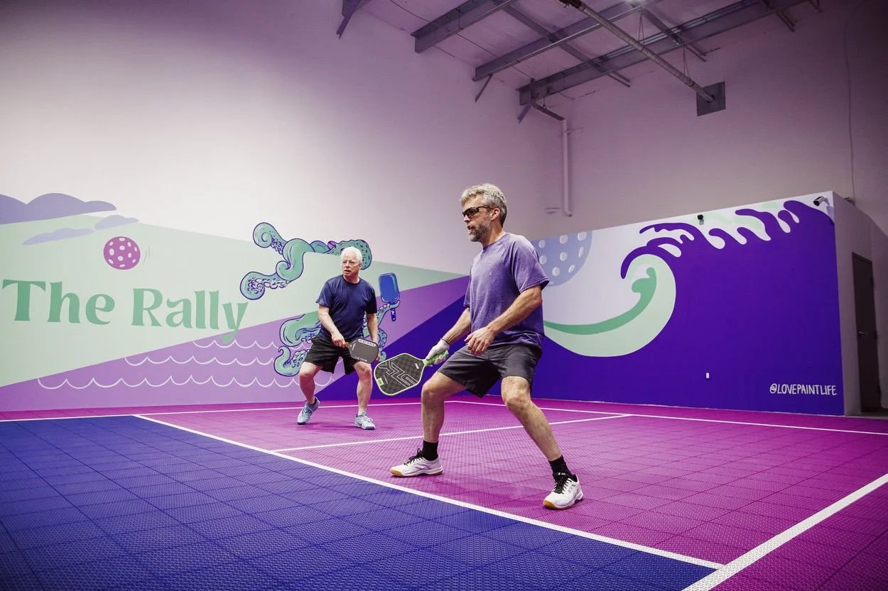 2 men playing pickleball at pickleball cove premium indoor facility