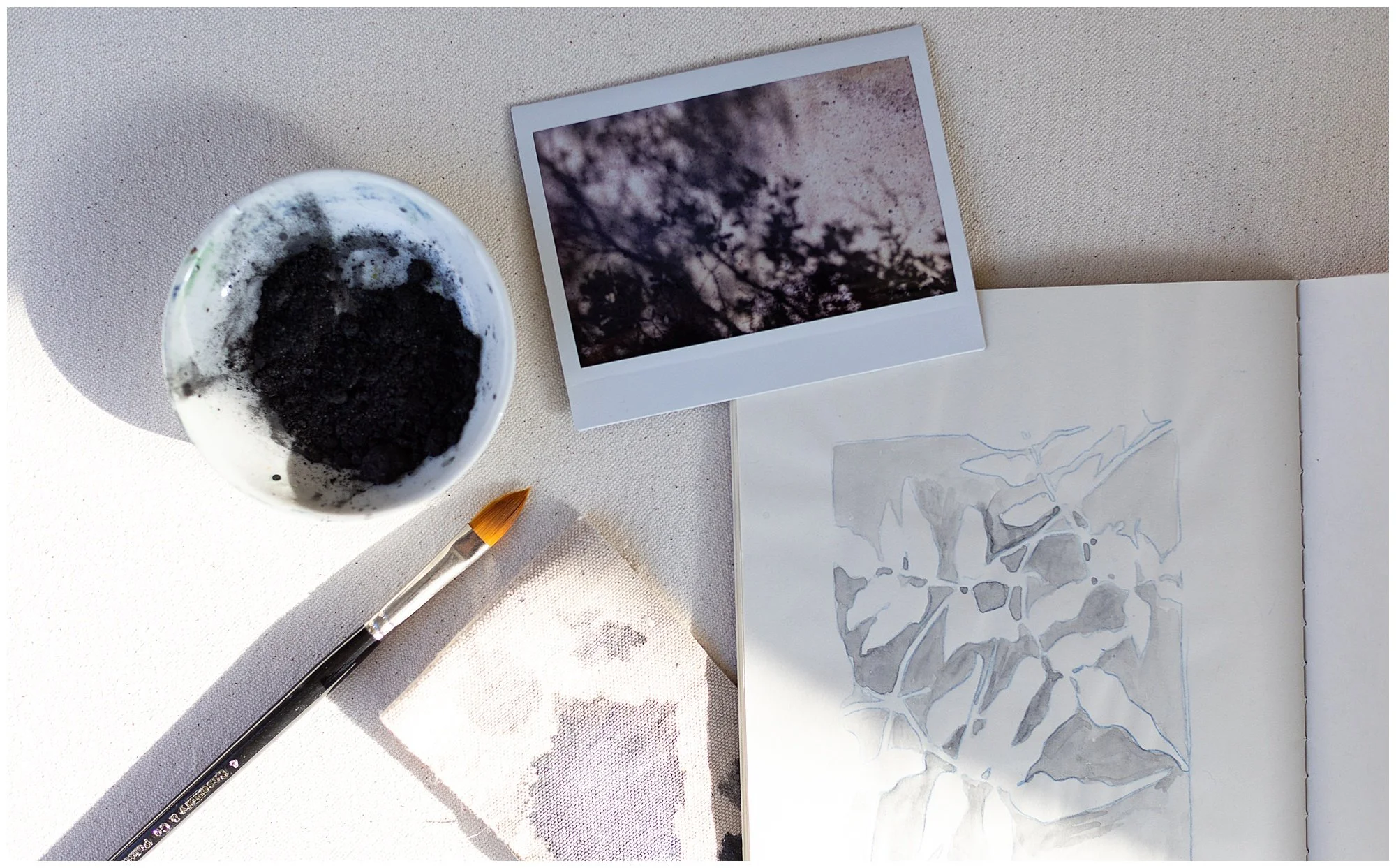 sketchbook flatlay with light web.jpg