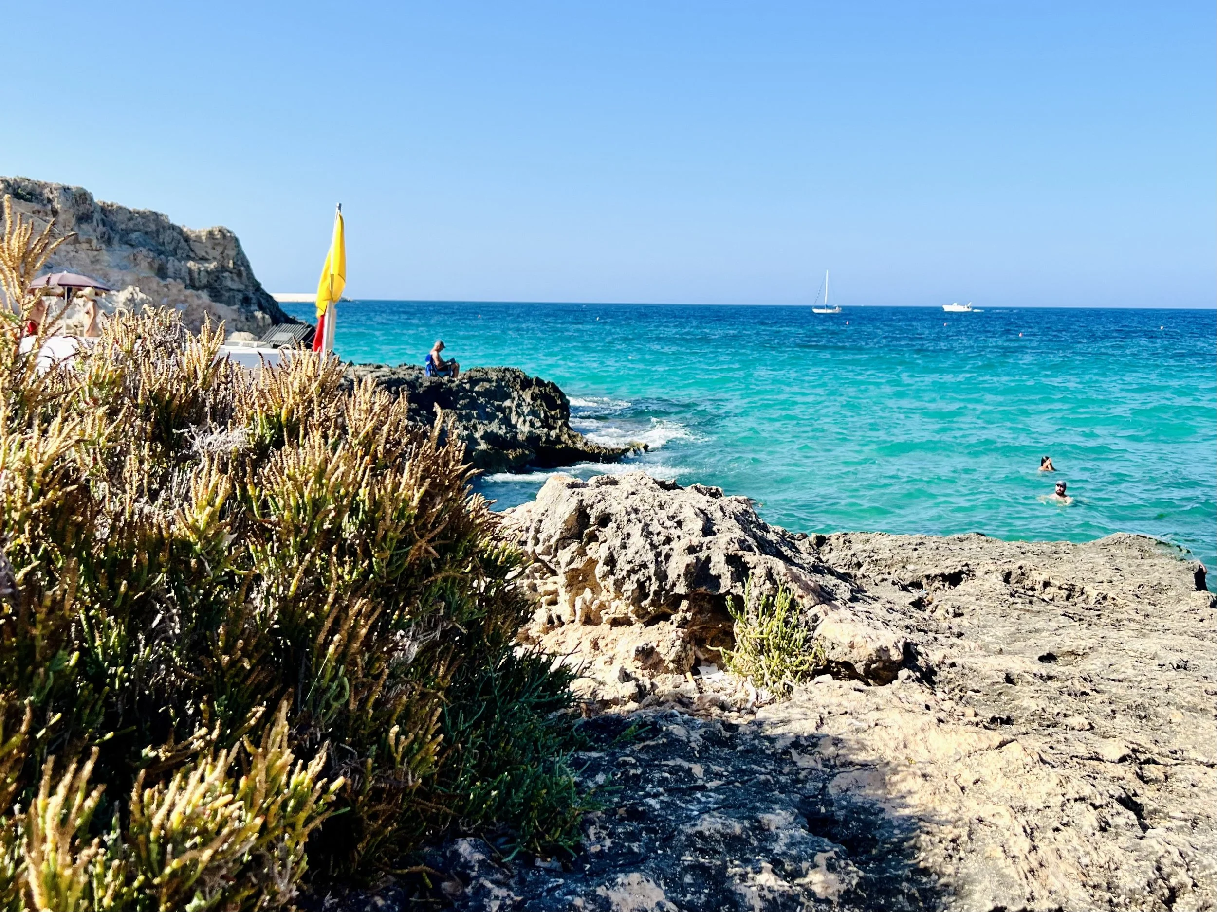 Turquoise sea and rocky shore on the Puglia coast