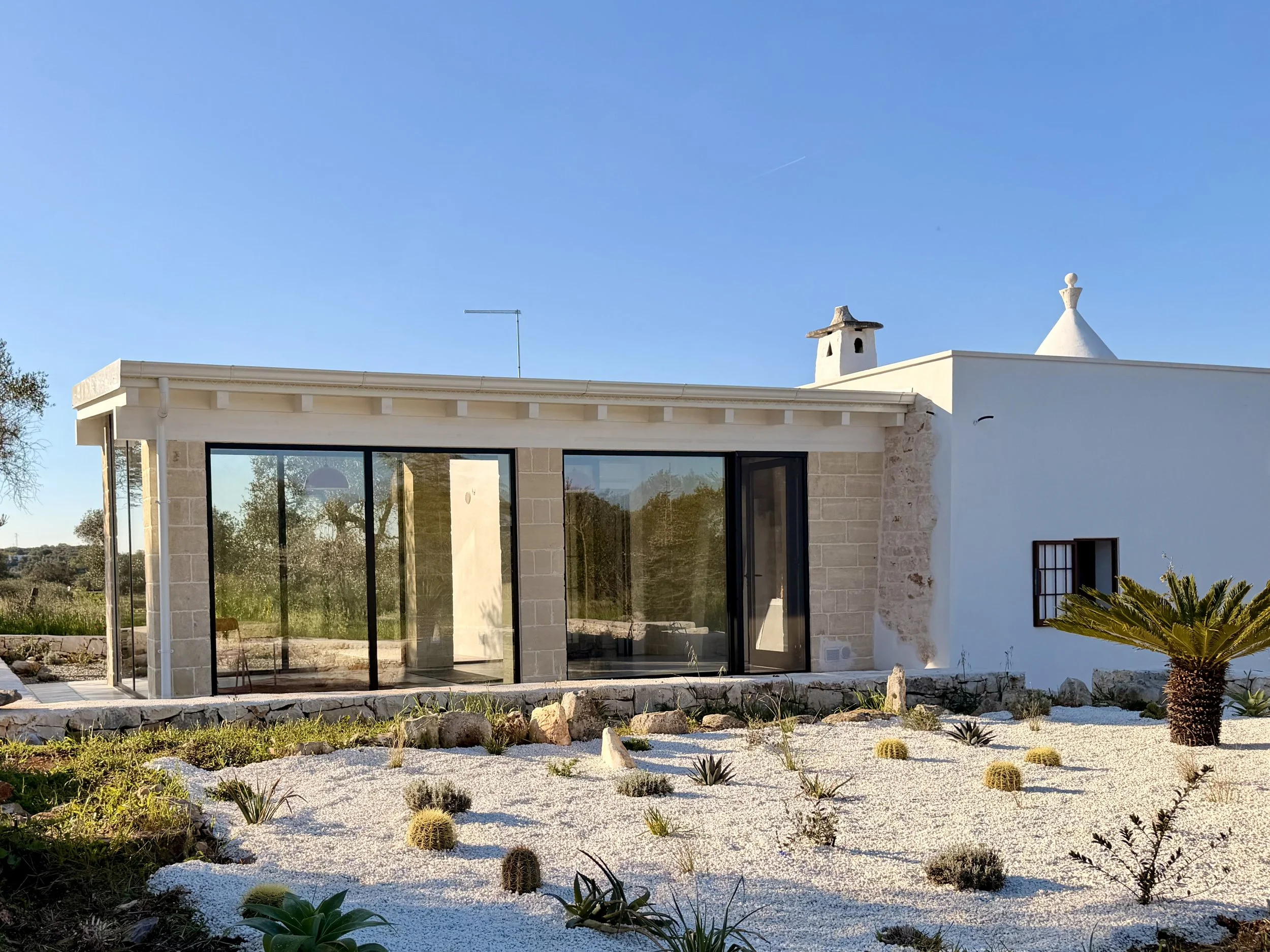 Modern villa wing and garden at Trullo Ostro in Puglia