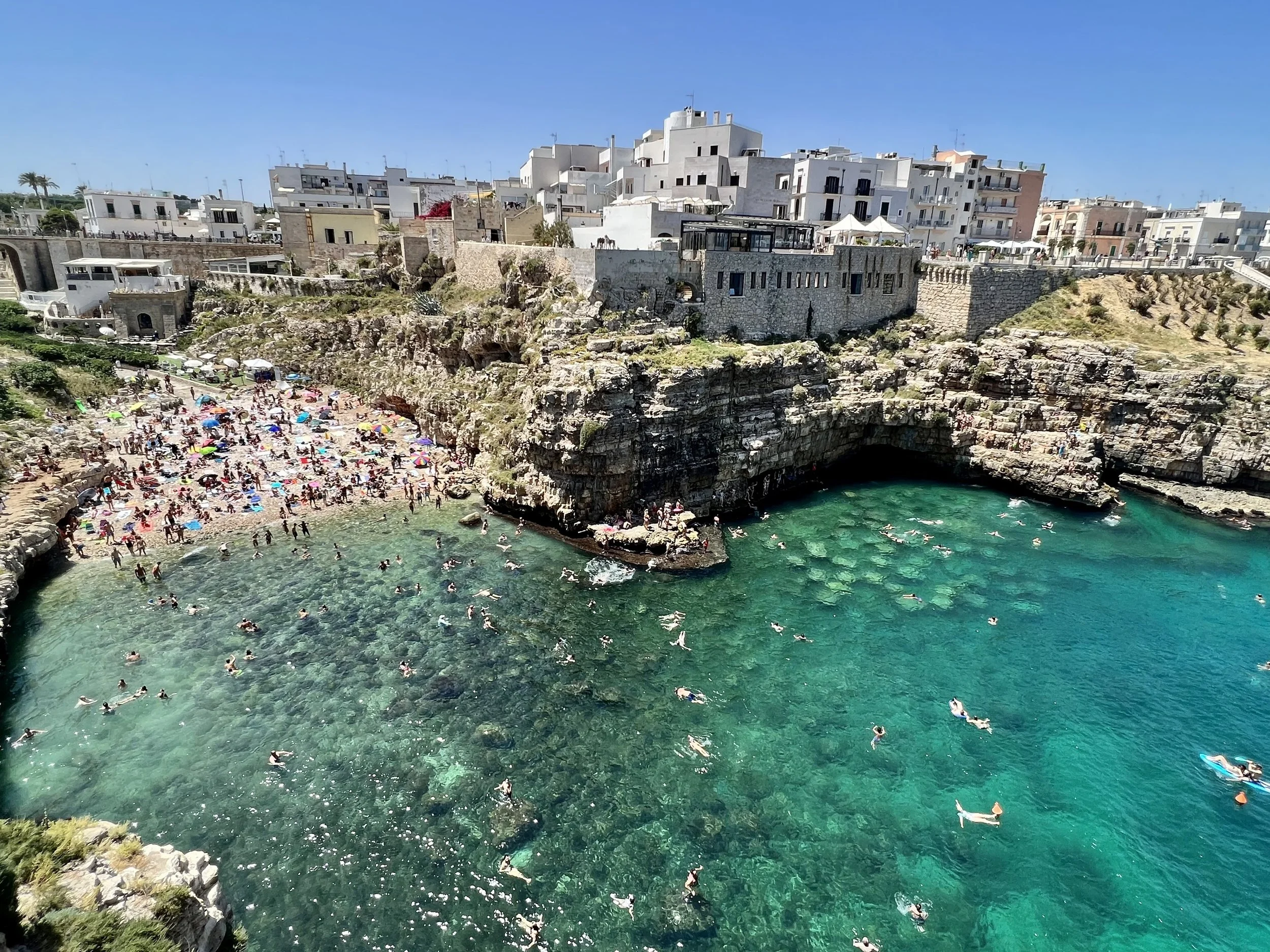 Turquoise cove and clifftop town of Polignano a Mare in Puglia