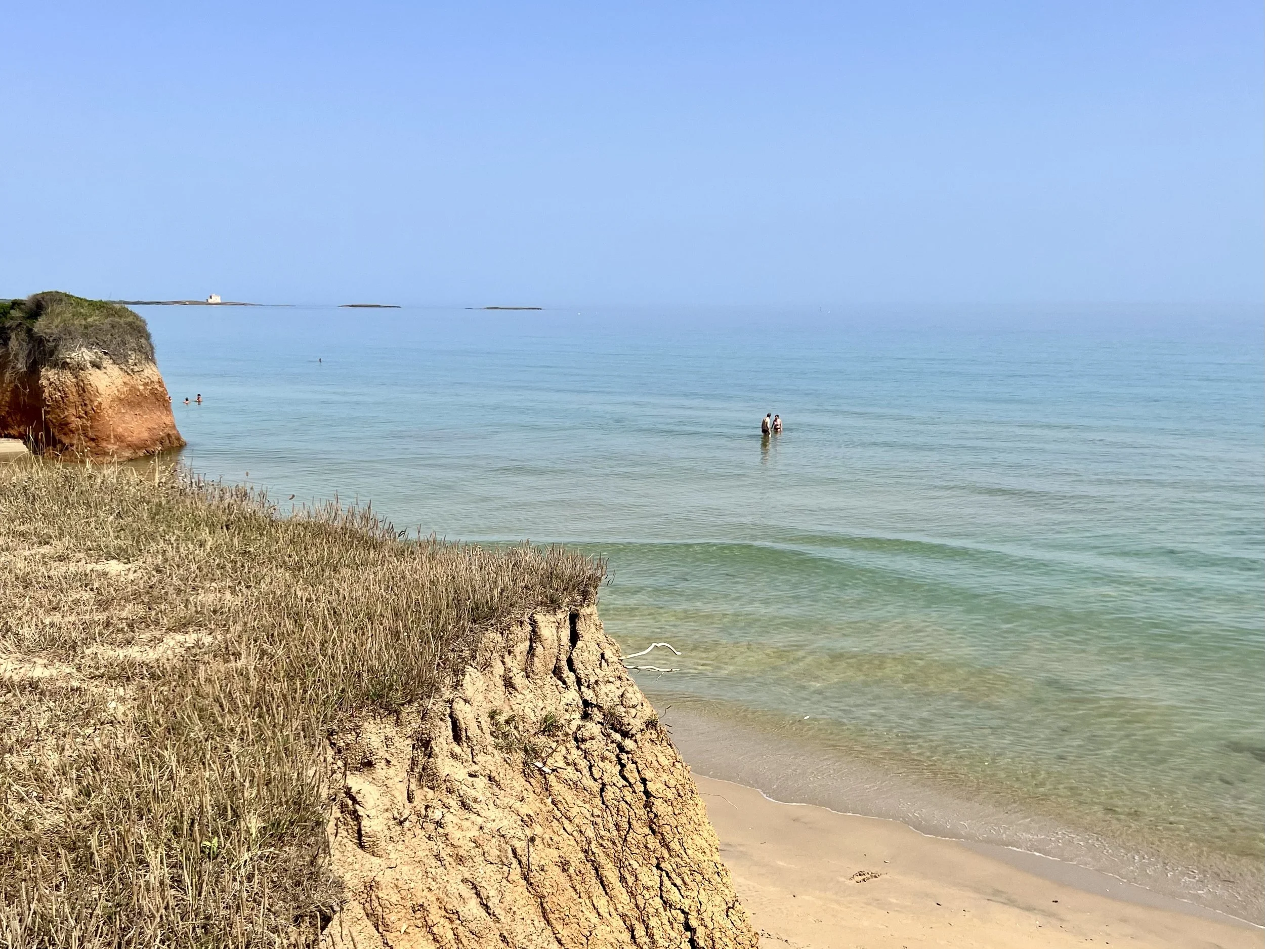 Sandy cliffs and calm sea on the Puglia coast