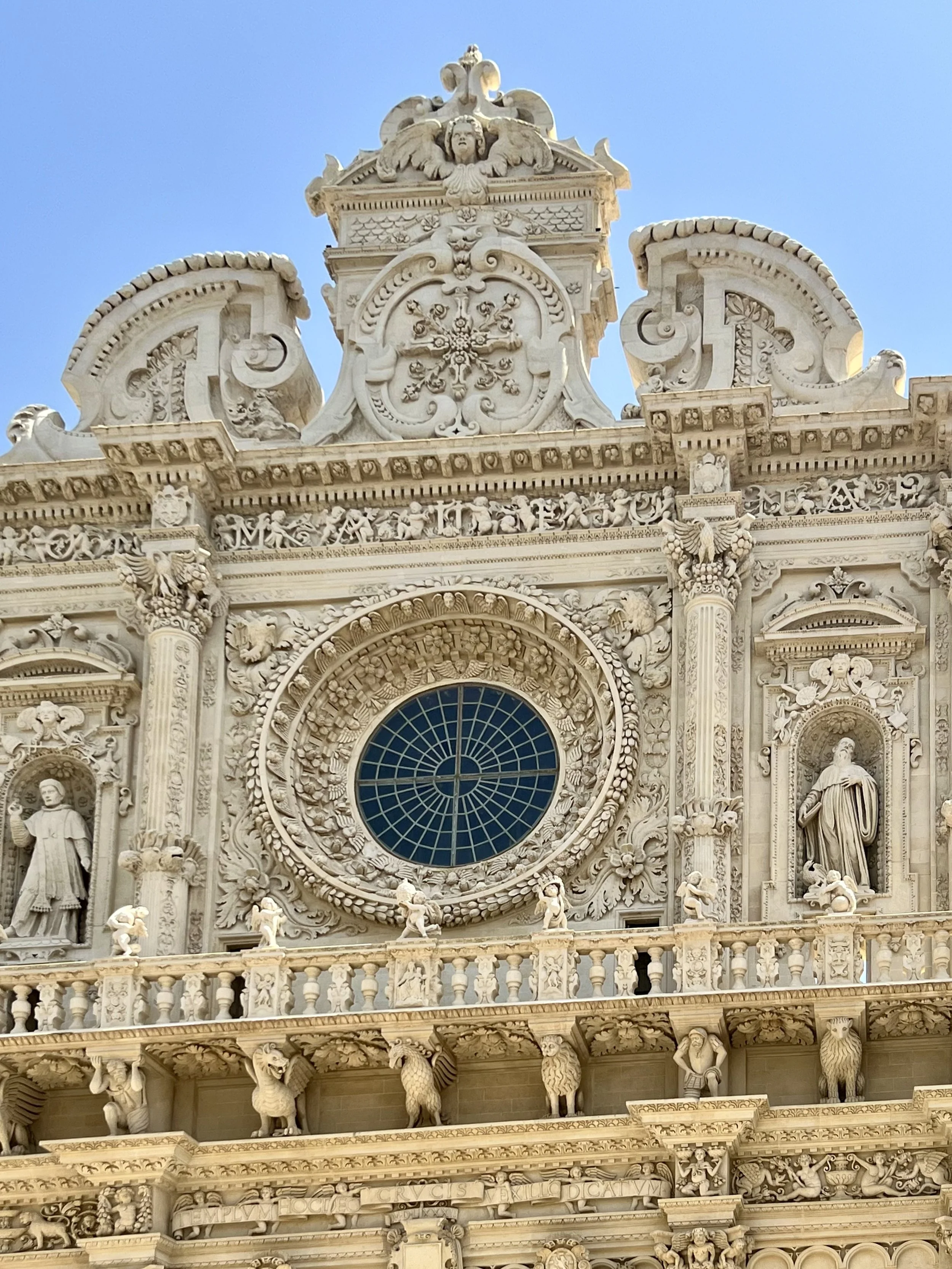 Baroque church facade with rose window in Puglia