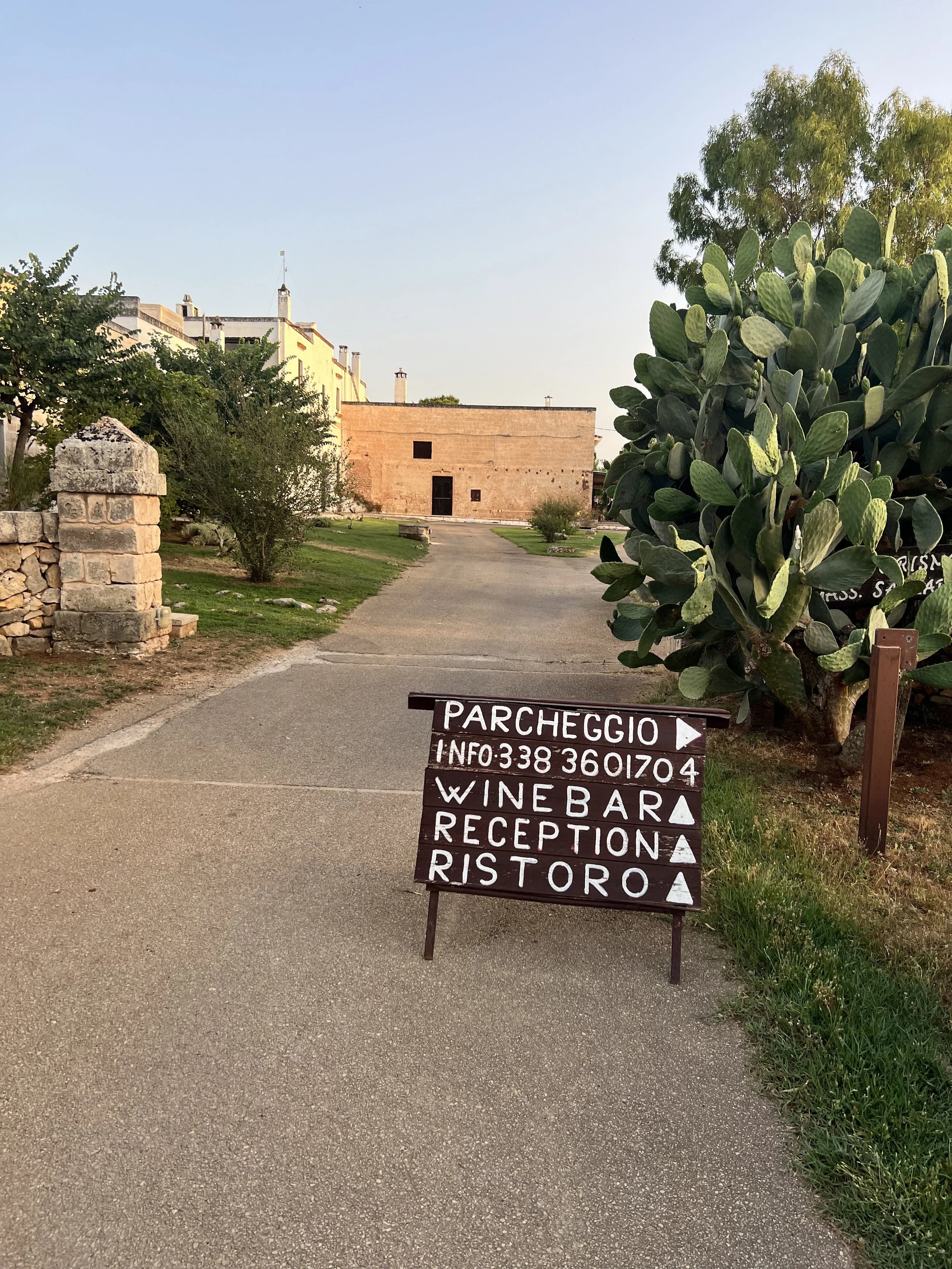 Masseria sign for parking, wine bar and restaurant in Puglia