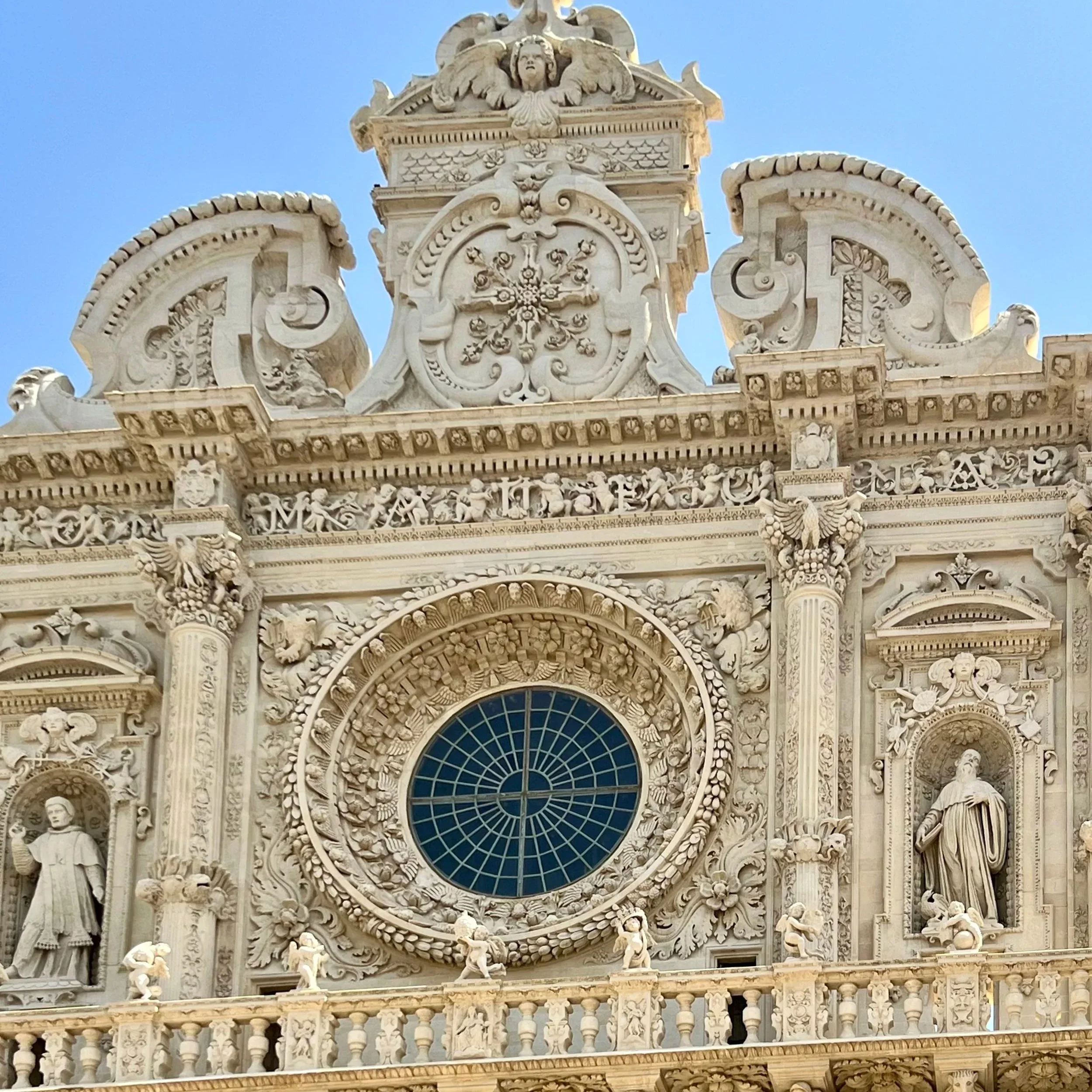 Baroque facade and rose window of the Basilica di Santa Croce in Lecce