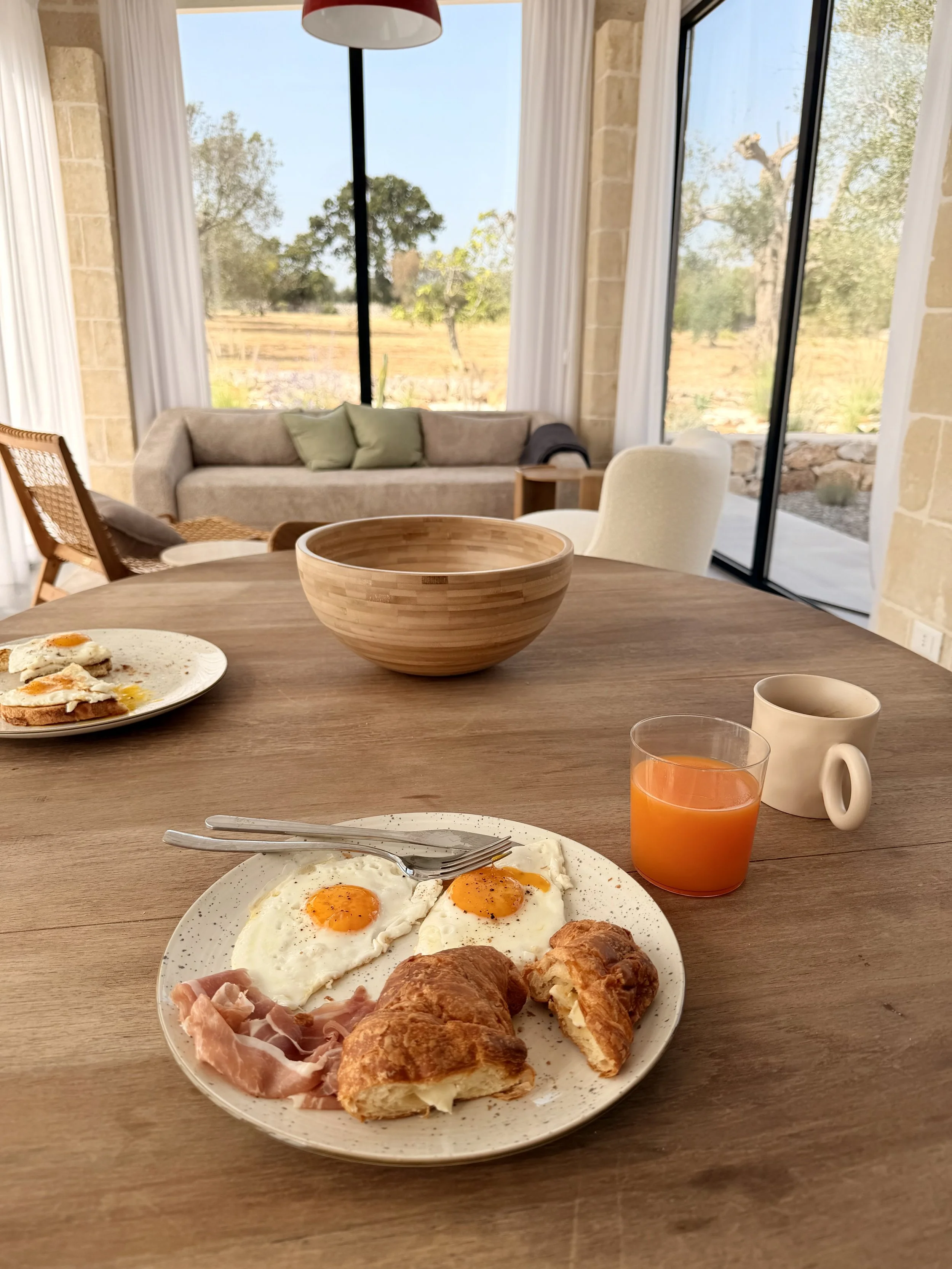 Breakfast of eggs, toast and orange juice at Trullo Ostro by Fable Retreats