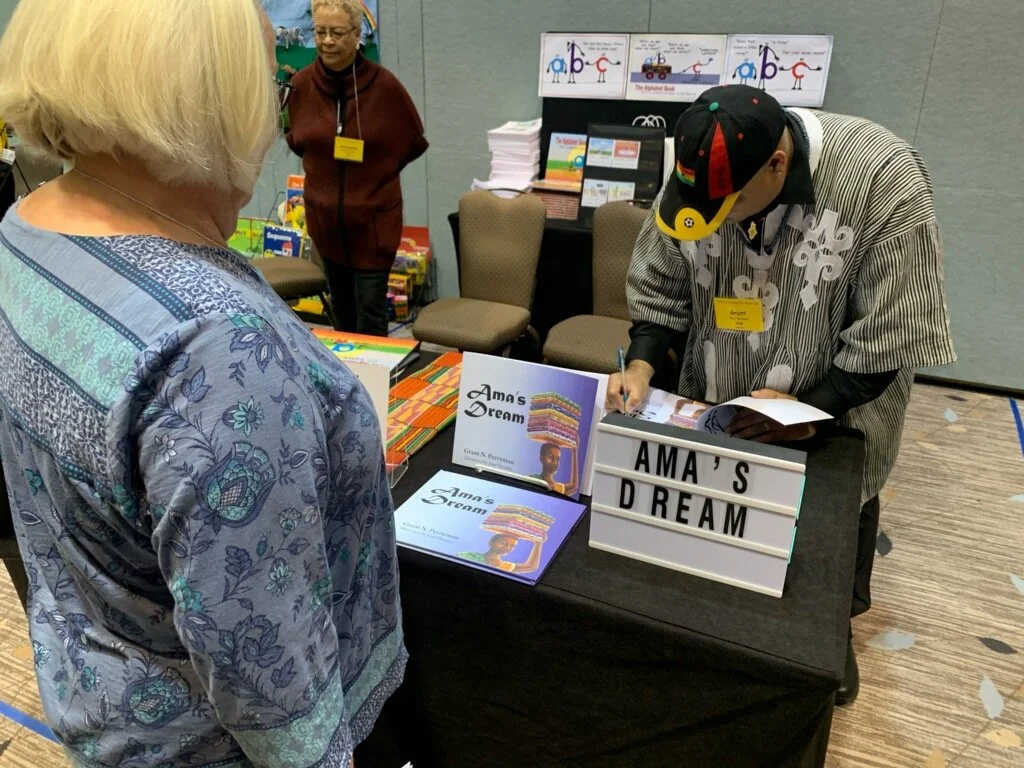 San Jose School Teacher Autographing Purchased Book