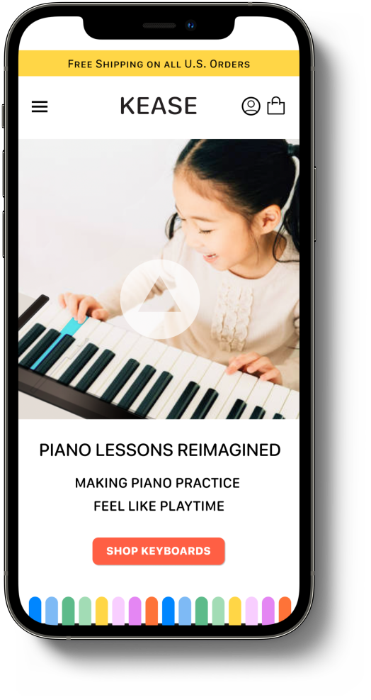 A young girl smiling as she plays a keyboard piano on a mobile website for KEASE, offering piano lessons and keyboards for sale, with free U.S. shipping banner at the top and colorful dots at the bottom.
