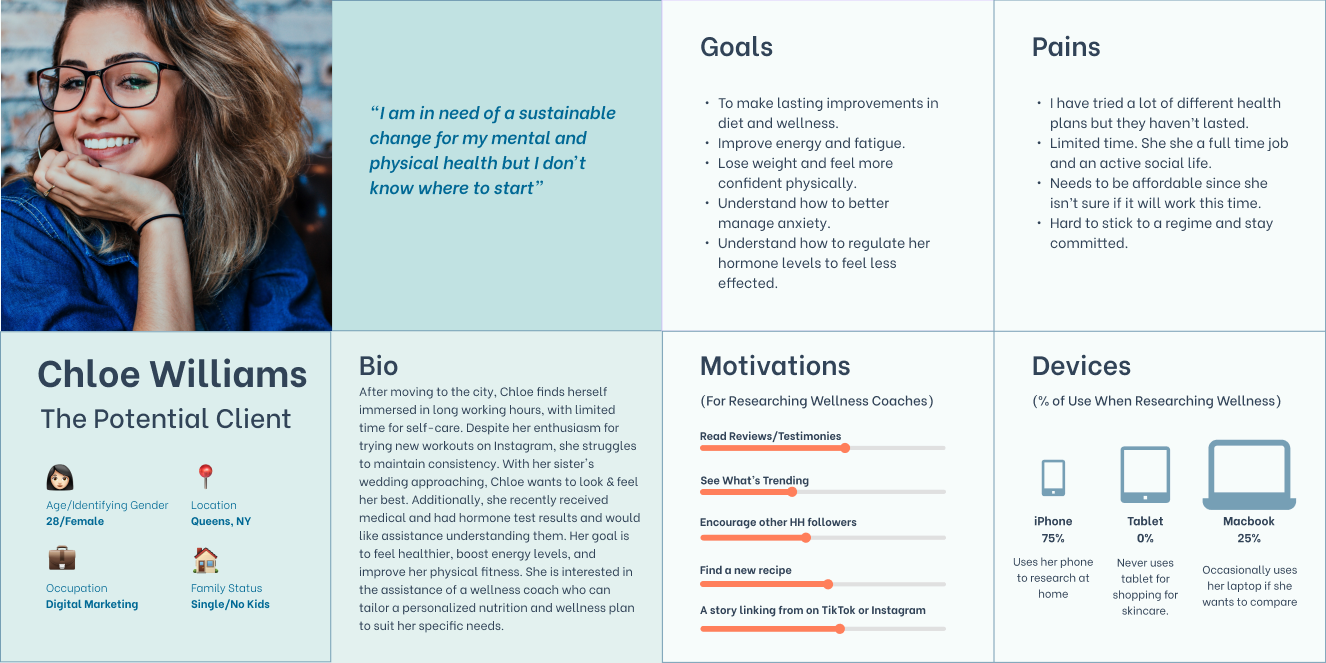 A person with glasses smiling and resting her chin on her hand in a denim jacket, with a background of a brick wall and some books.