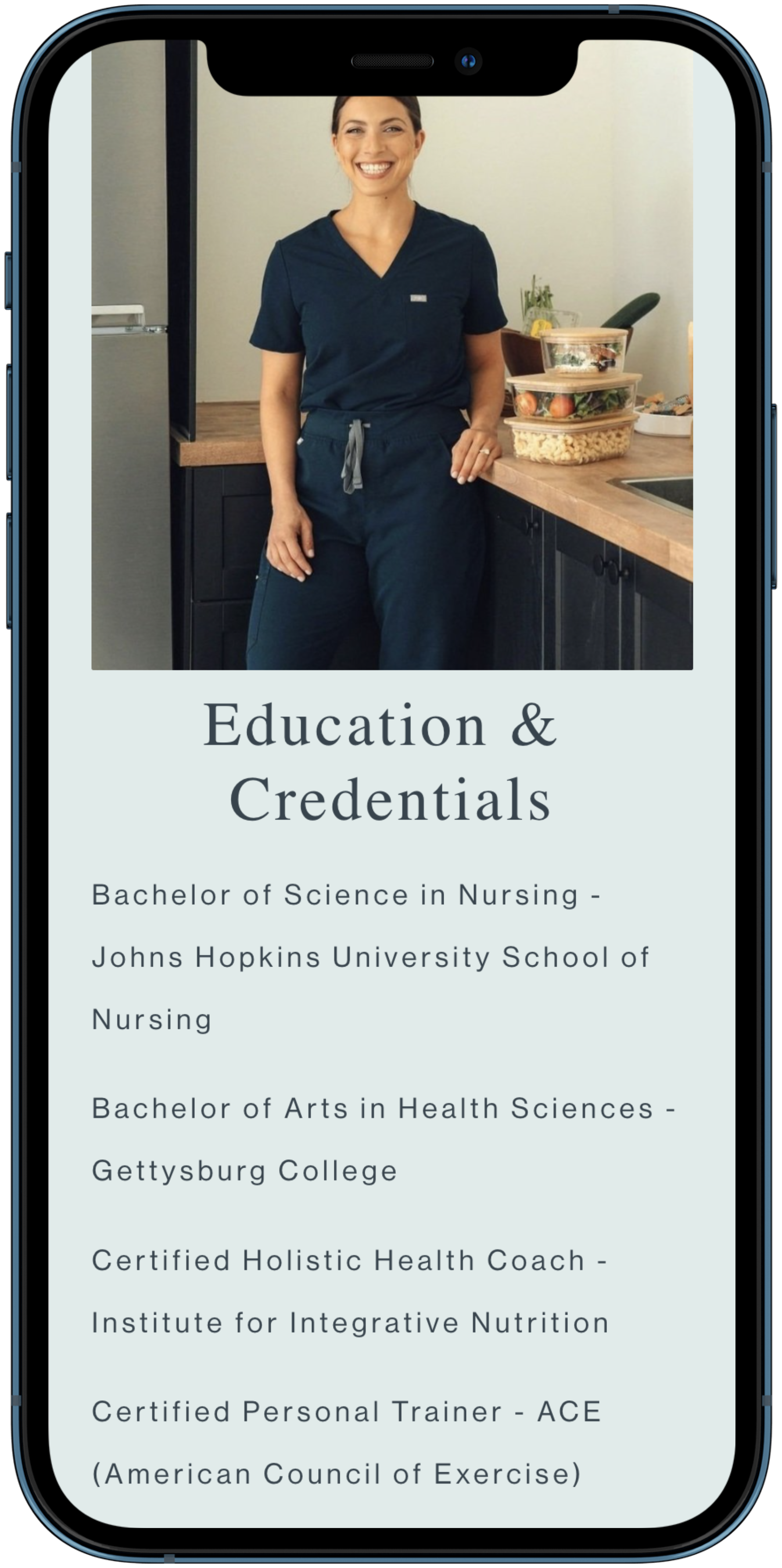 A woman in navy medical scrubs standing in a kitchen with a smile, next to a counter with food containers, on a smartphone screen displaying educational credentials in nursing, health sciences, and health coaching.