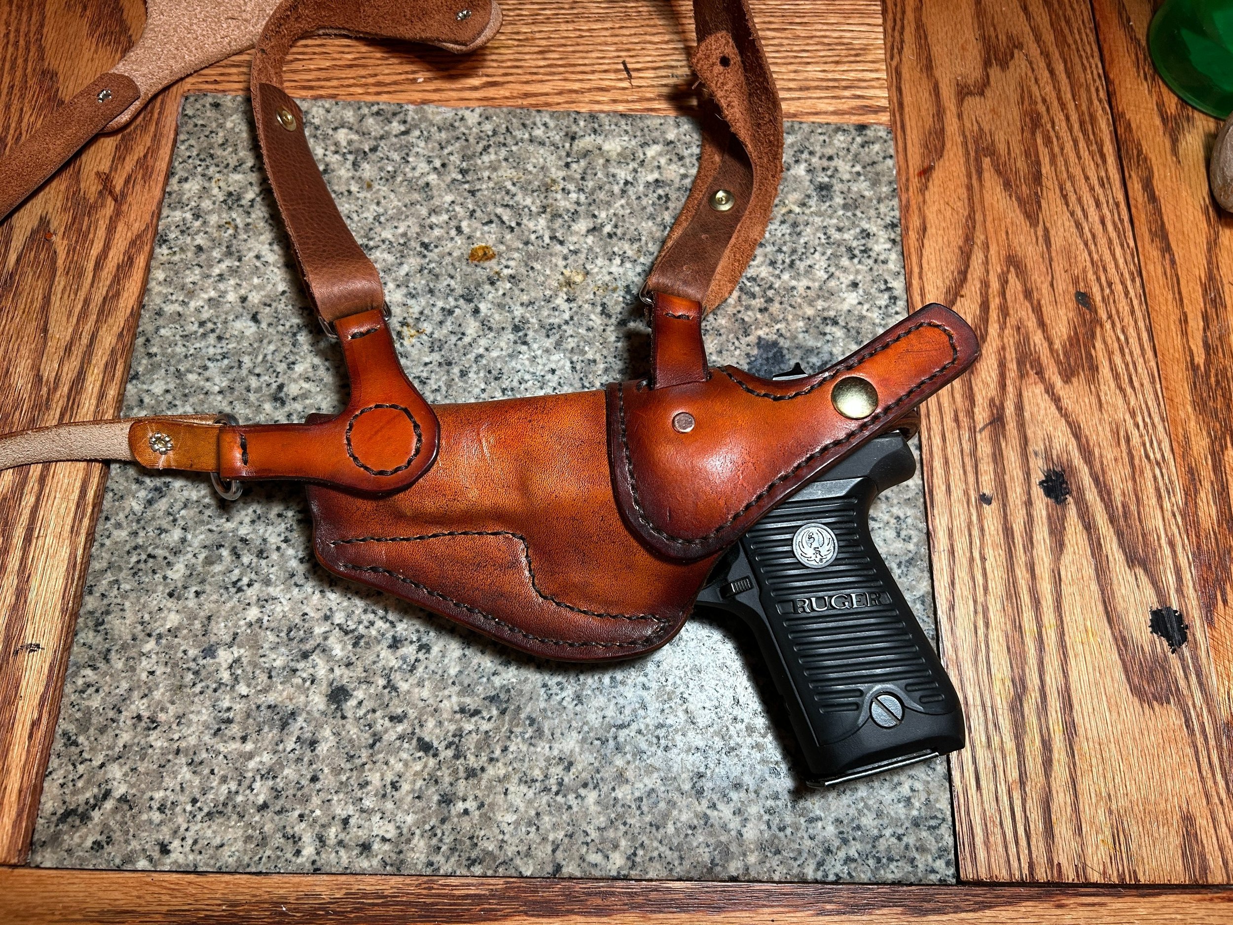 A backside (body side) of a custom-made leather holster for a semi-automatic