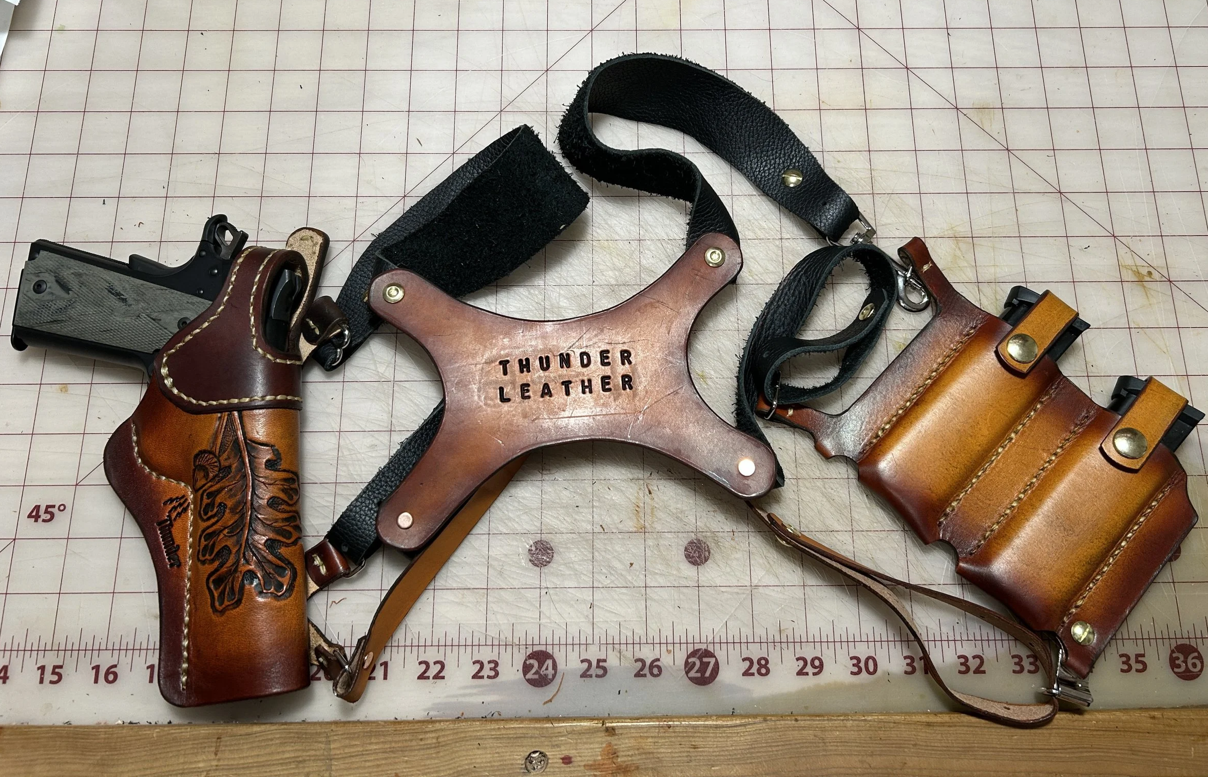 Leather custom made for a 1911 Semi-Automatic pistol with a double Mag pouch.
