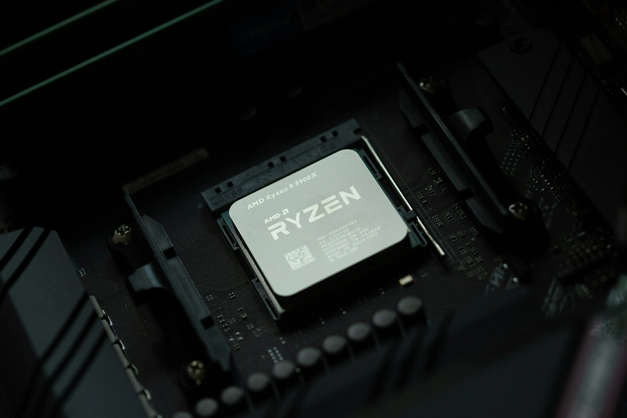 Close-up of an AMD Ryzen 9 5900X processor installed in a computer motherboard.