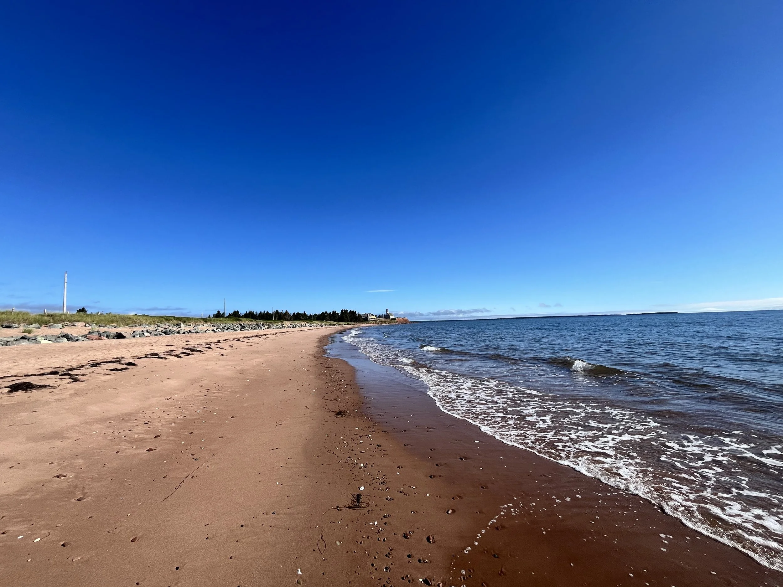 Panmere Island Beach, blue skies and waves coming on to shore