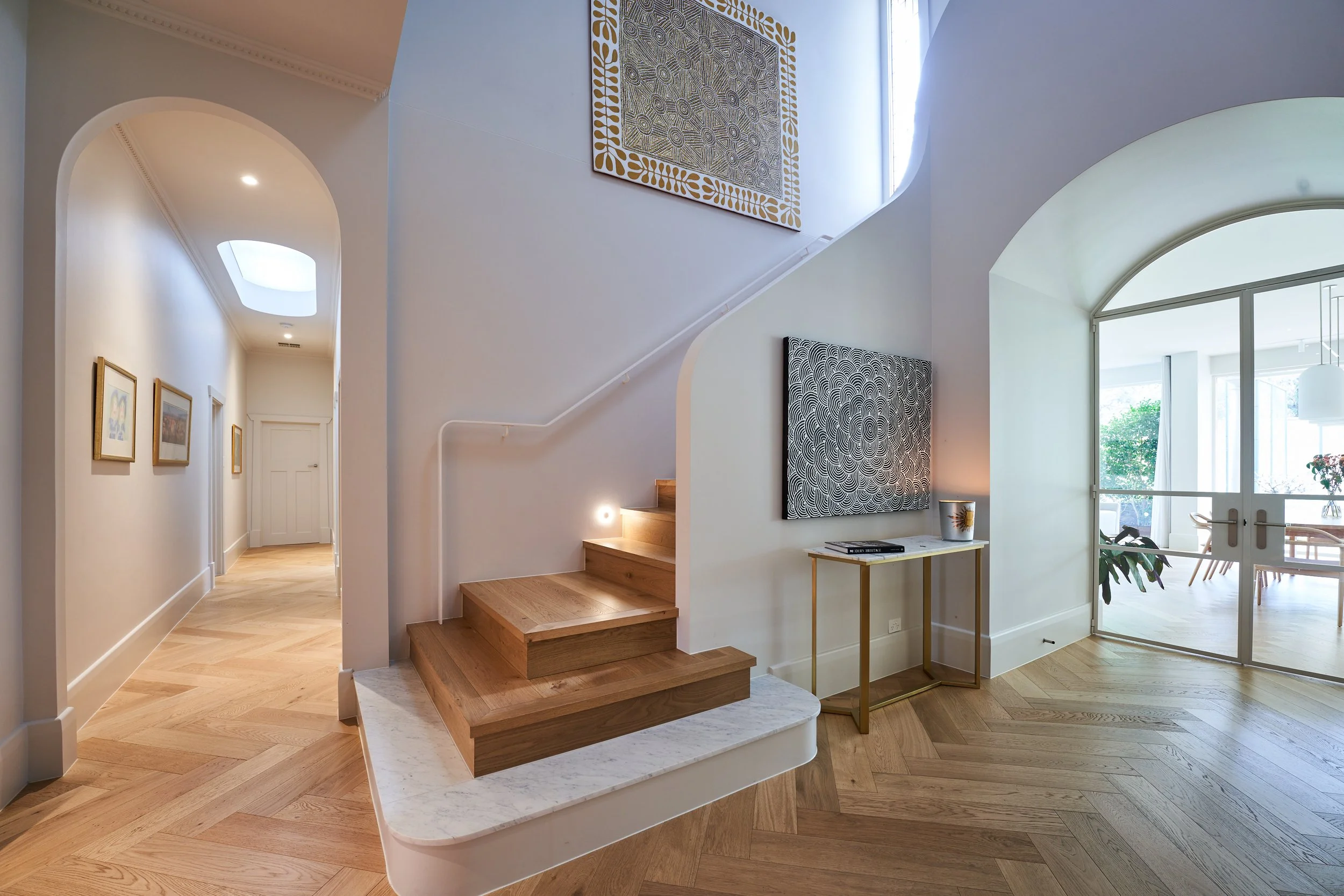 A large gold Artwork by Debra Nangala McDonald for the stairwell, sourced by one Rundle Interiors.