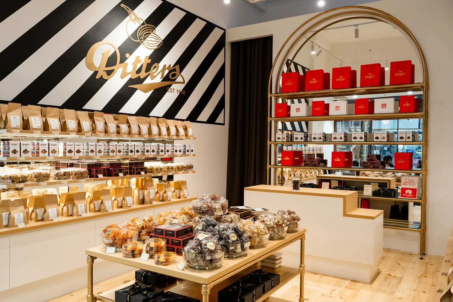 Recently completed for @dittersnuts : bespoke gold-finished shelving units &mdash; including central displays and a large arched feature for the rear wall. Designed by us and expertly crafted by Hughes &amp; Hill Fabrication, these refined details de