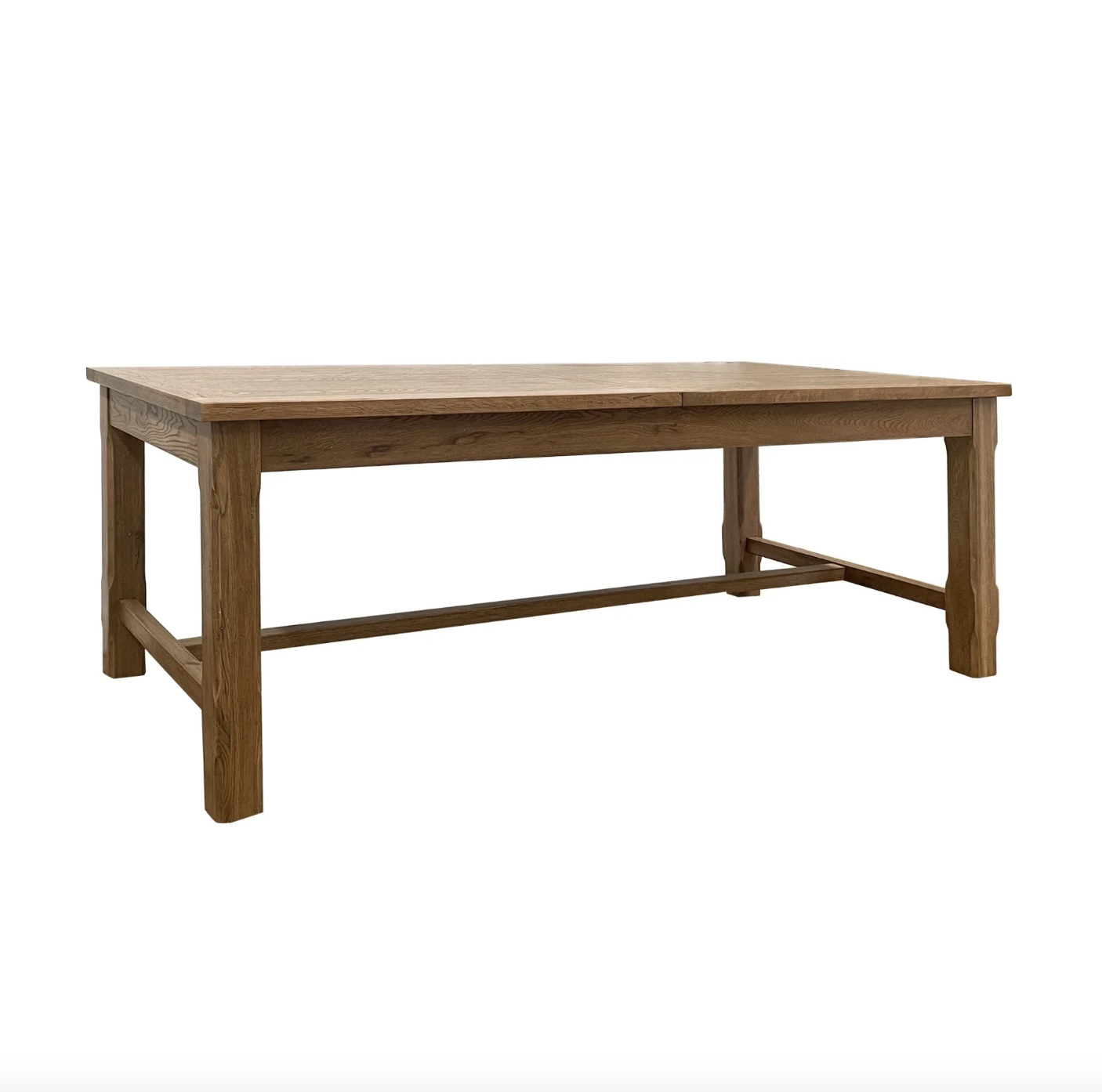 A sophisticated dining table designed for entertaining, featuring a luxurious oak wood finish and a sturdy solid timber frame. Extending up to 3.1 meters, it offers ample space for both intimate gatherings and larger celebrations.