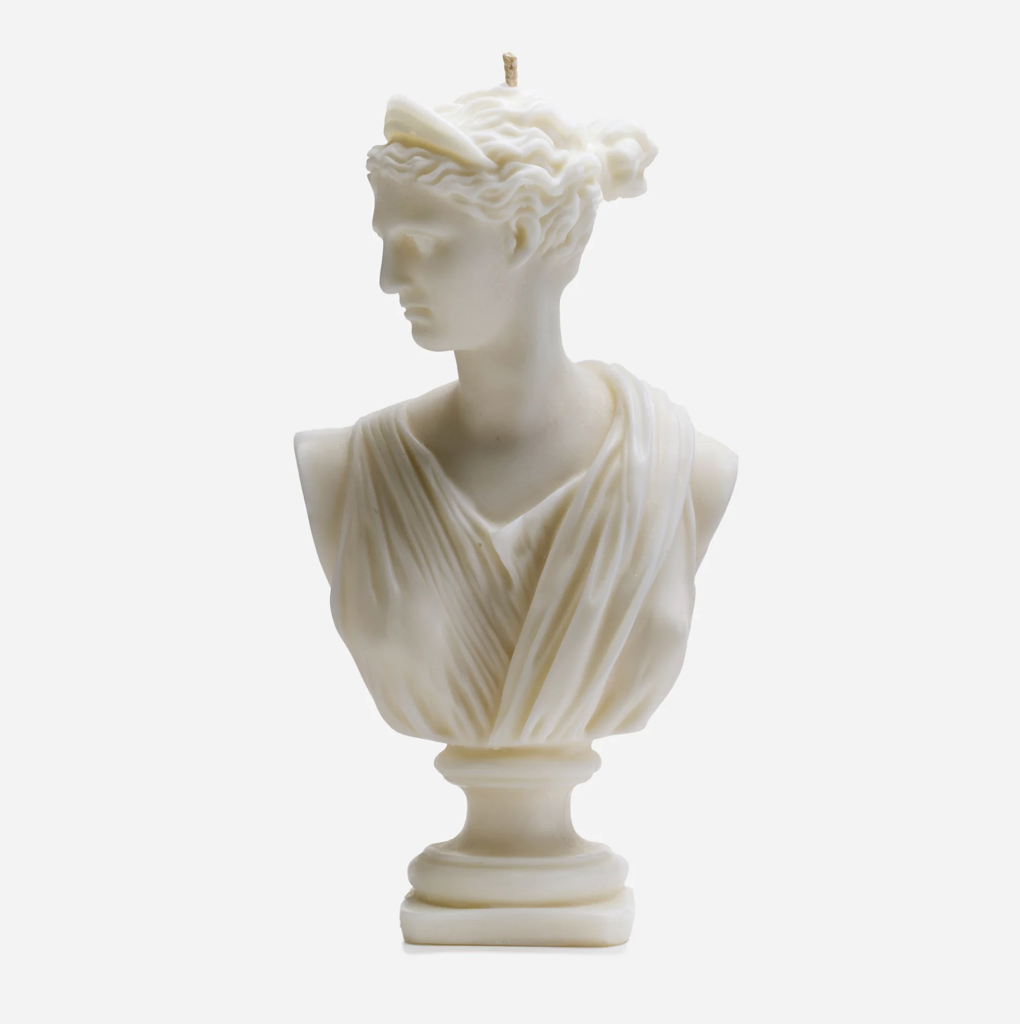 The Artemis Bust Candle is a handcrafted beeswax candle inspired by the Greek goddess Artemis. Its detailed sculptural design makes it a stunning addition to any living space.