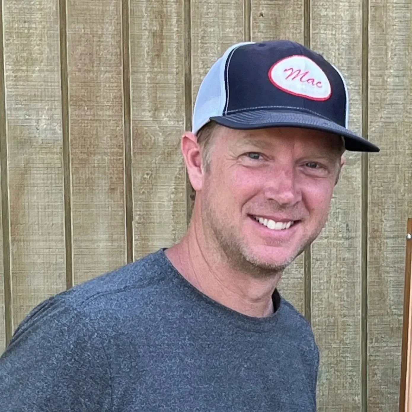 Mavericks Football Club logo featuring a flower, stars, and orange, black, and white colors.