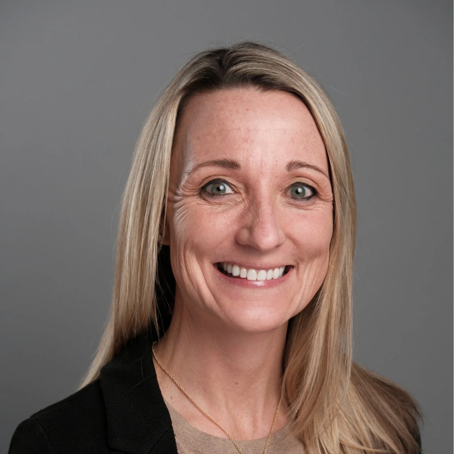 Mavericks Football Club logo featuring a circular design with black, white, and orange colors, a floral emblem in the center, and a black star flanked by two orange stars at the top.