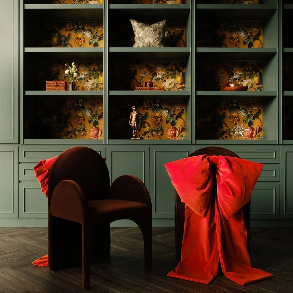 The actual statement piece is a custom chair with a distinctive orange bow. This design was inspired by an evening gown we had come across on Pinterest; its back was similarly adorned with a large bow.

Orange velvet fabric was used to craft the bow,
