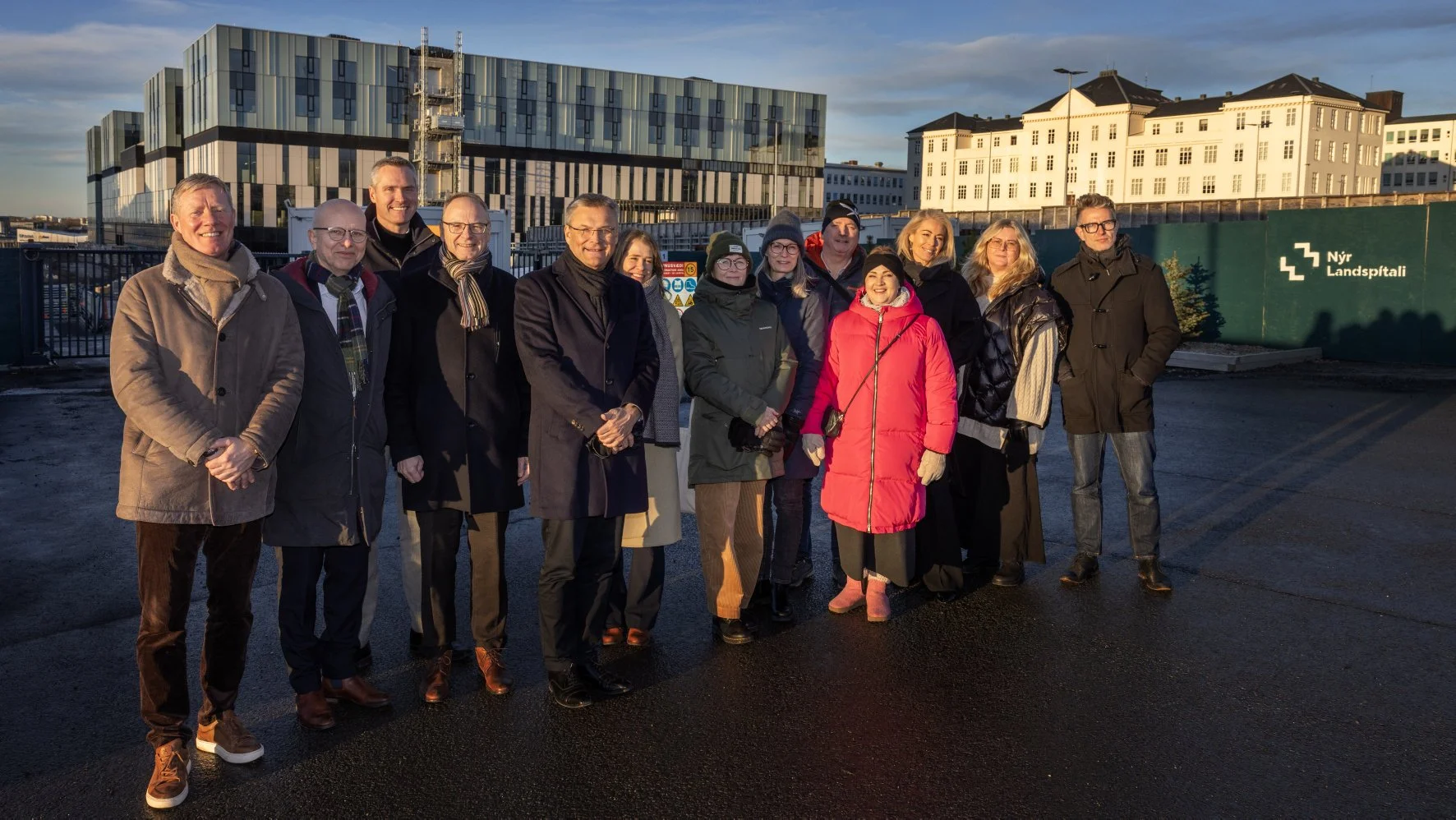 The executive NUHA group standing together, a total of 13 people, outside of Landspitali in Reykjavik.