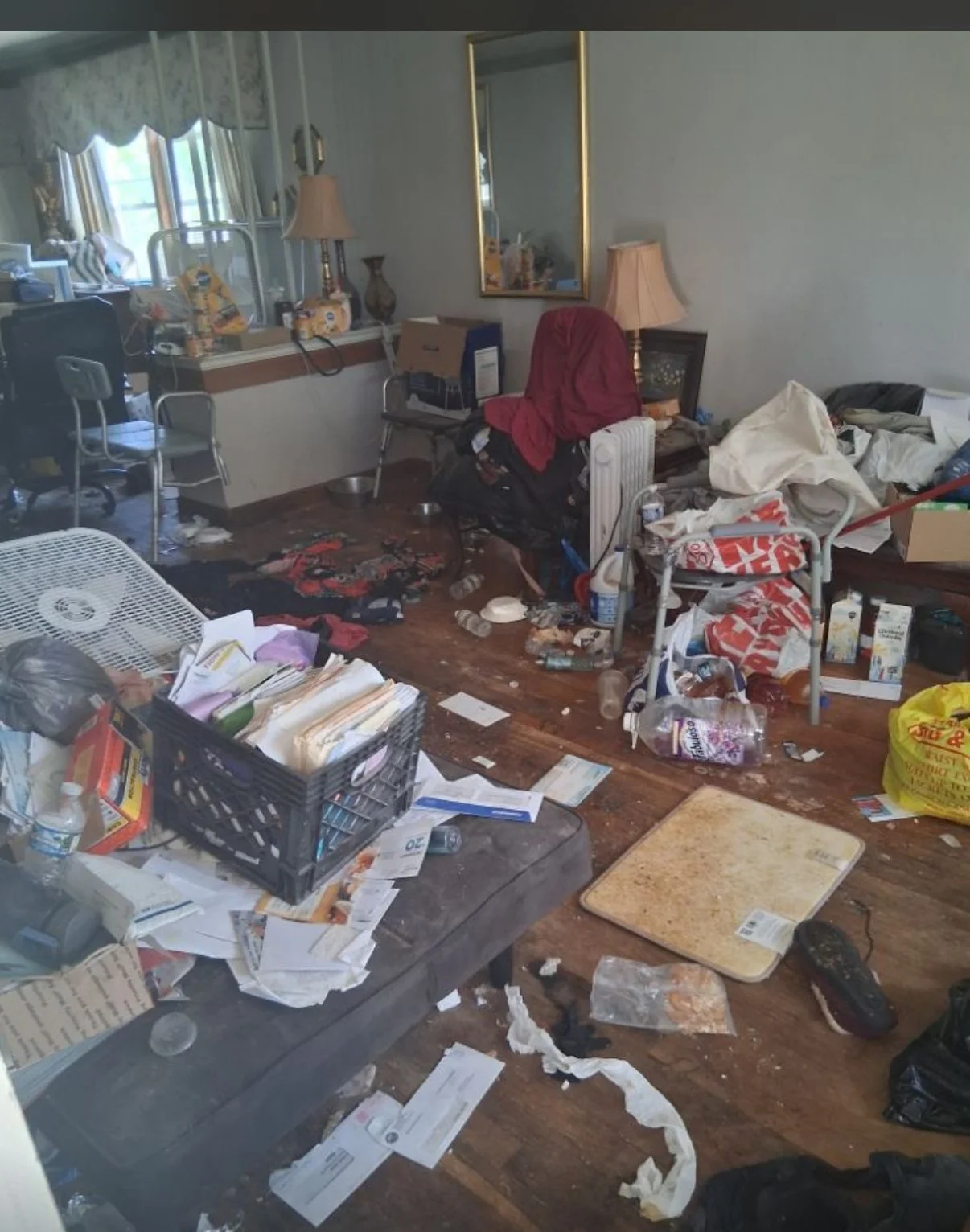Before image of a cluttered home living room prior to professional decluttering and deep cleaning by Chicago TidyFixers. LLC