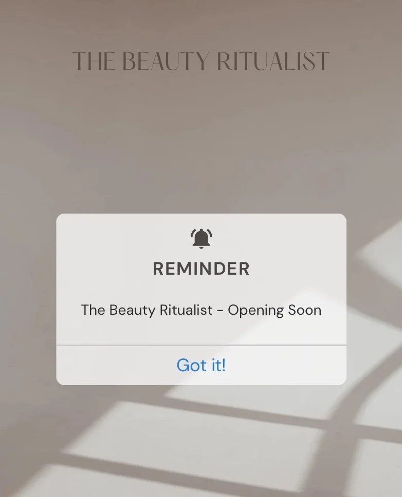Notification screen with a reminder message about 'The Beauty Ritualist' opening soon, with a shadow pattern on the background wall.