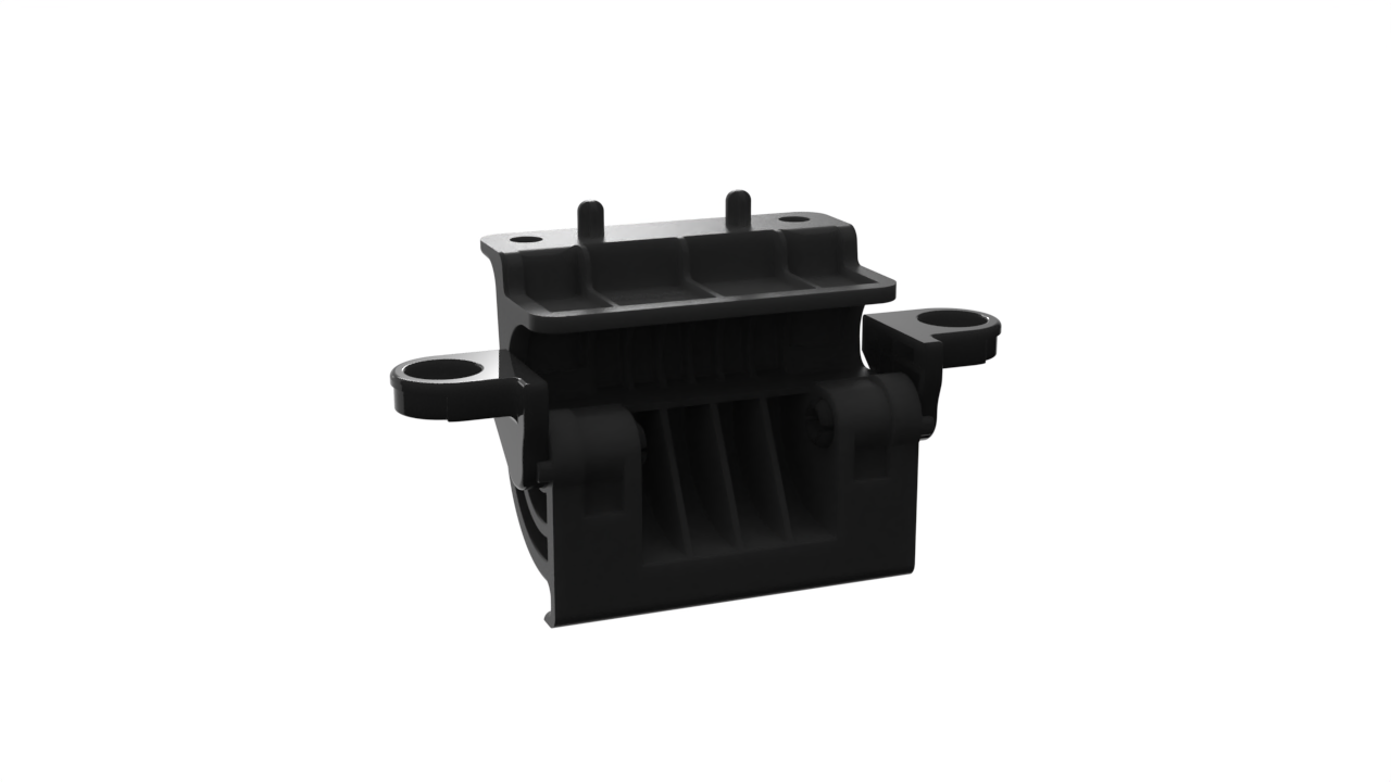 A black mechanical component with gaps and mounting points, possibly a part of a larger device or machinery.