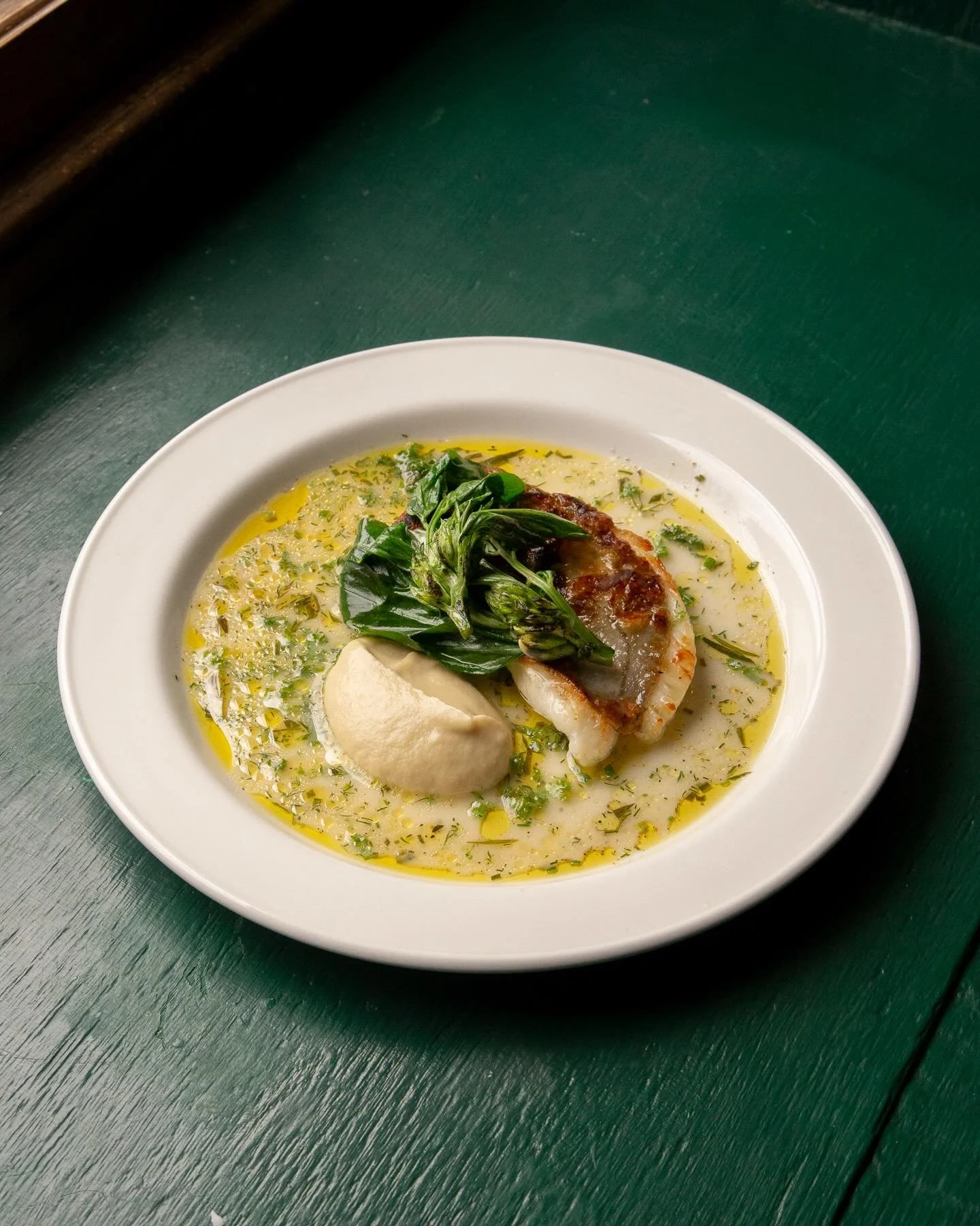 The dish from our aforementioned post - John Dory, soubise, broad bean tops from @aral.farm