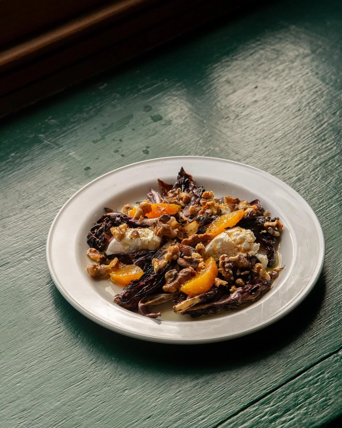 Charred radicchio, goat&rsquo;s curd from @whitelakecheese, orange and toasted walnuts. The bitter leafed radicchio takes us through the cold months offering a soft leafed vegetable when others refuse to grow. Its bitterness responds well to heavy ha