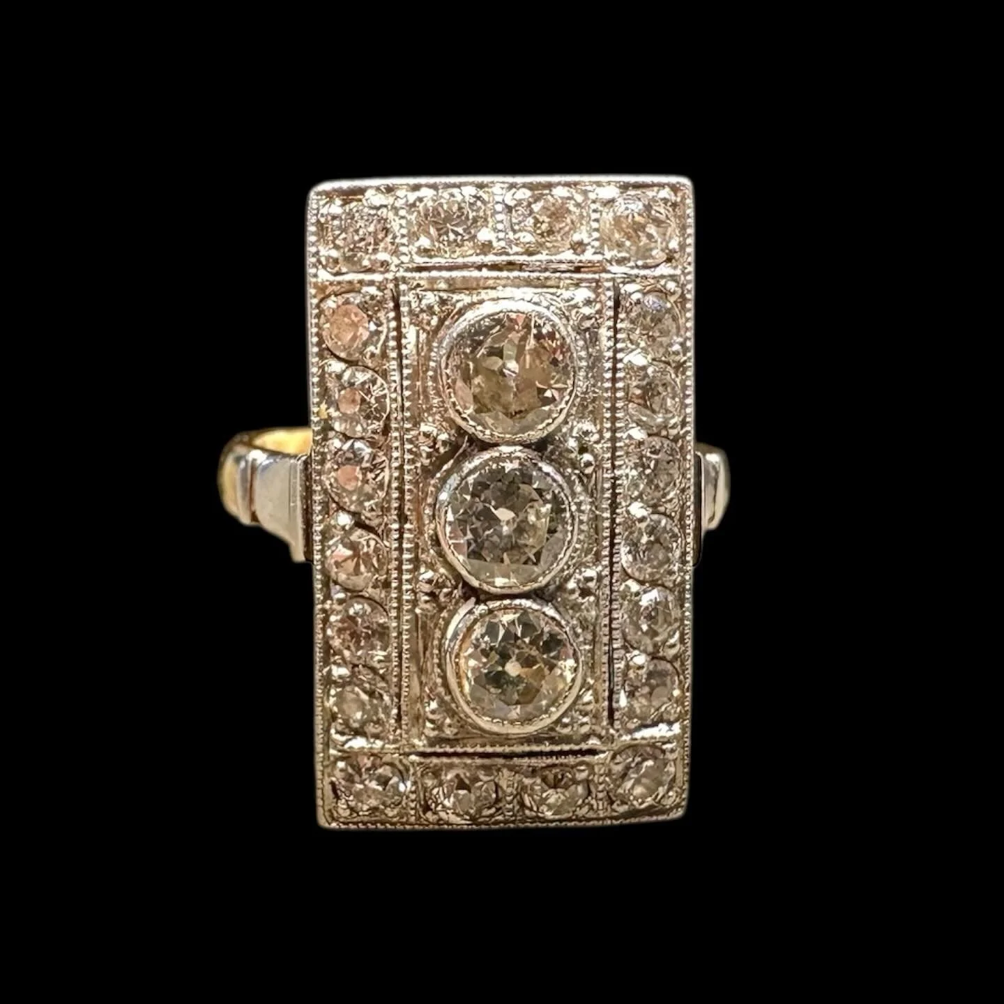 ✨ Art Deco Elegance in Every Detail ✨

Feast your eyes on this stunning original Art Deco ring, a true statement piece from the roaring 1920s. Crafted in 18k yellow and platinum, it boasts a striking geometric design with three central old-cut diamon