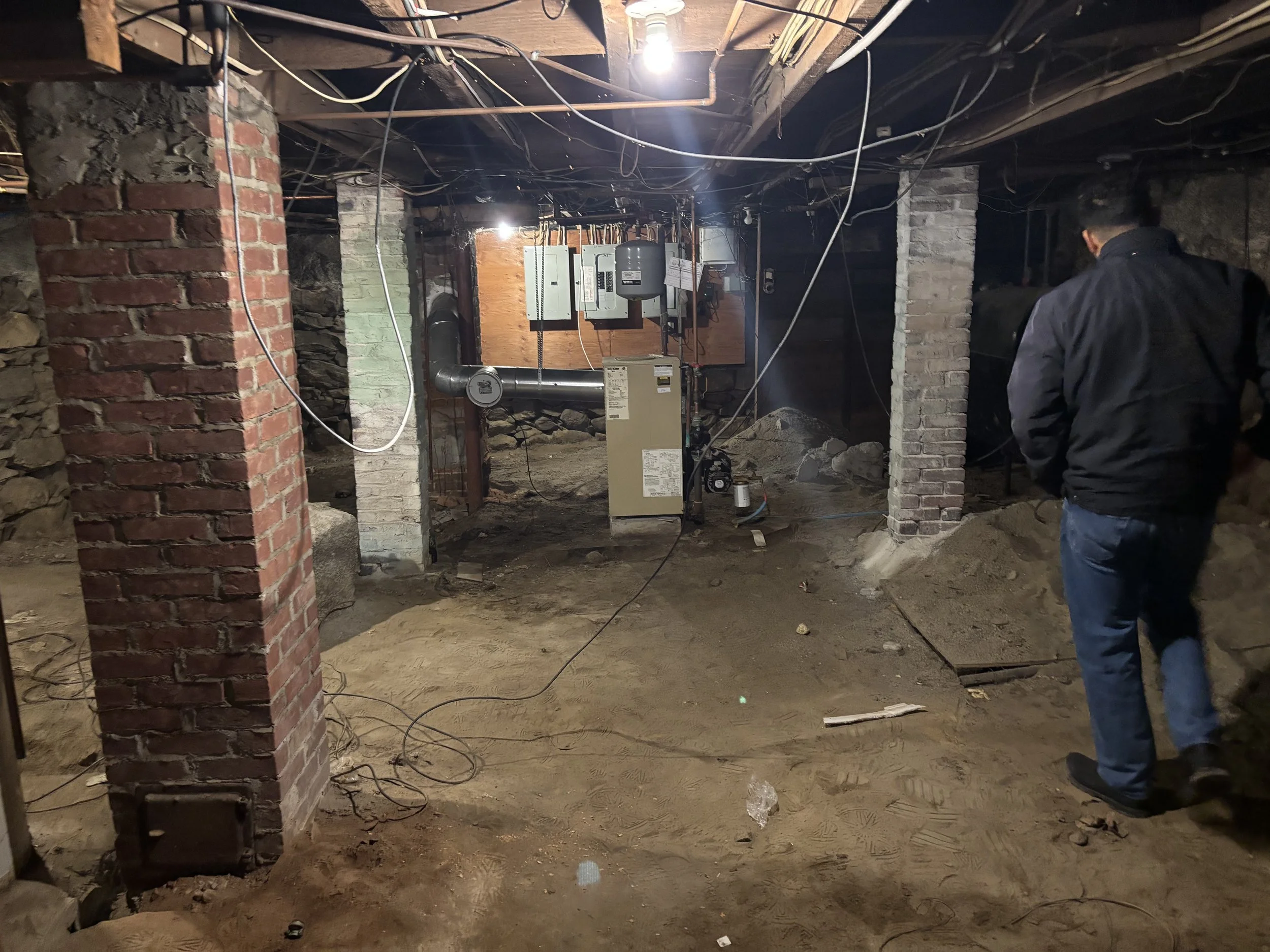 an unfinished basement with construction debris around