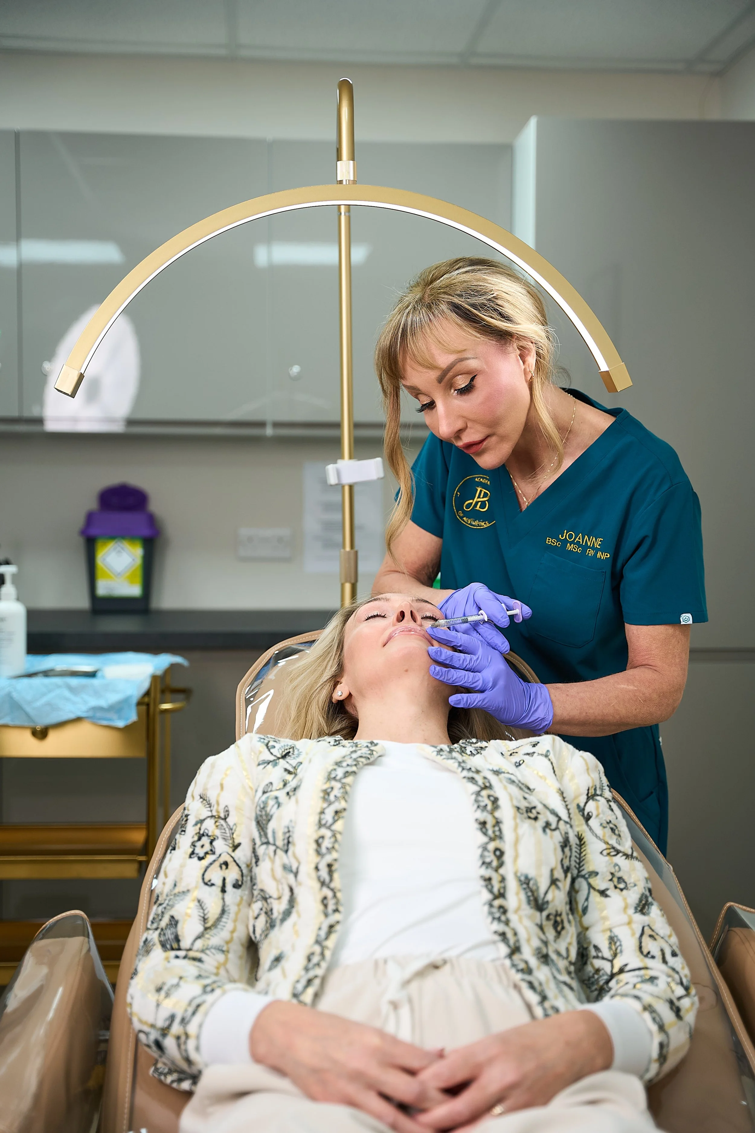 Joanne Brannan, nurse practitioner and clinic owner administering botox treatment, JB Academy of Aesthetics, Kirkintilloch Glasgow