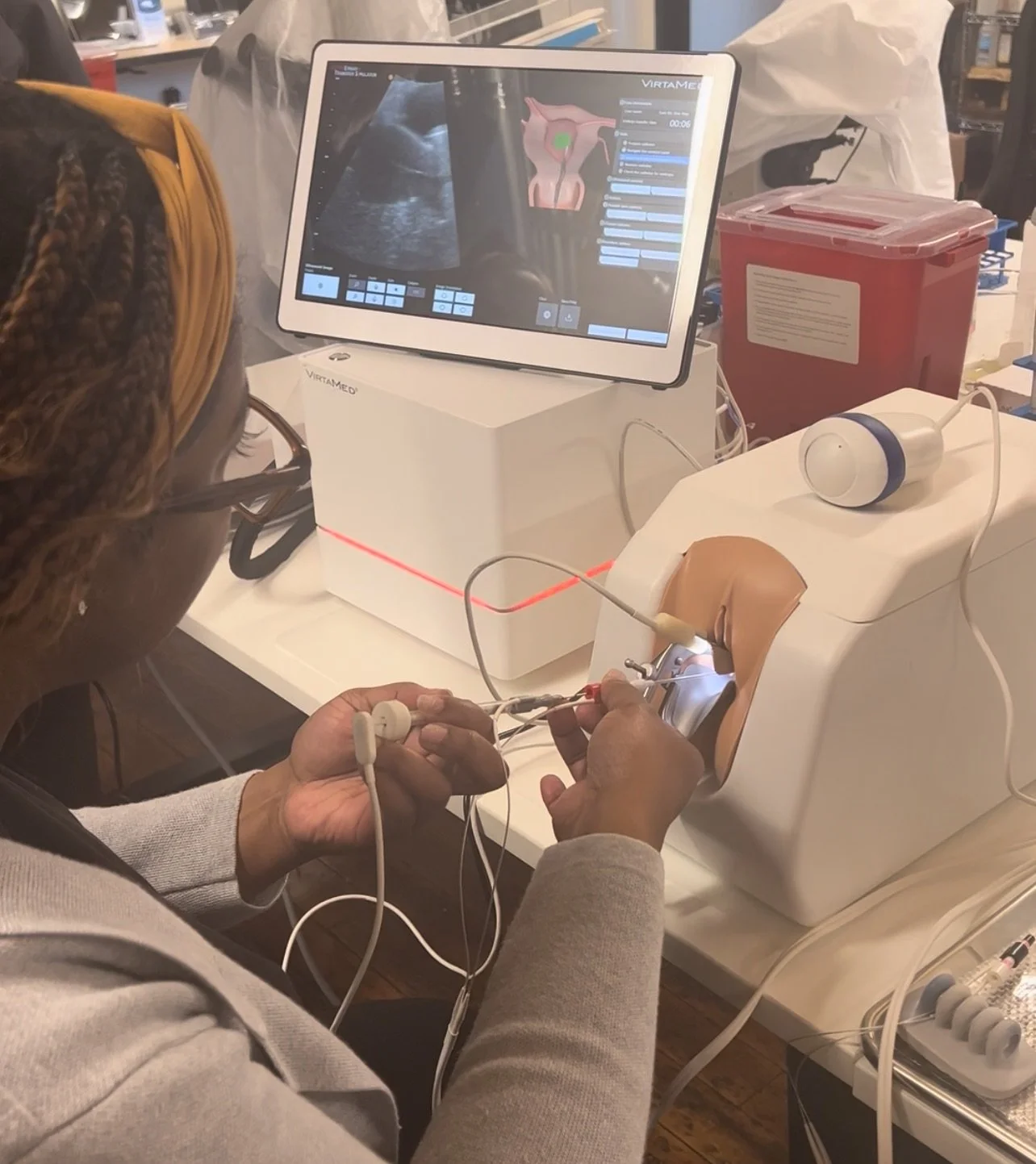 During an advanced reproductive OBGYN course, our founder practices catheter insertion techniques using specialized training equipment. This hands-on clinical training in assisted reproductive procedures enhanced her technical skills and clinical exp