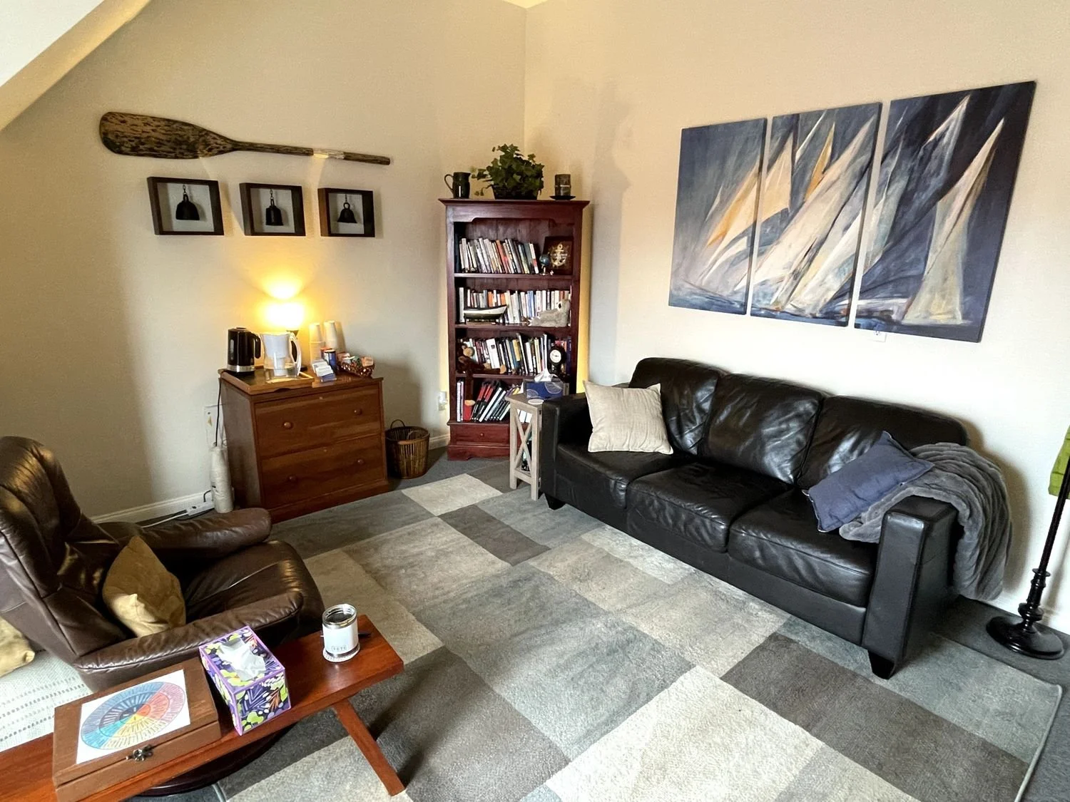 Edmonds, WA therapy office of Matthew Tiemyer featuring comfortable couches and inviting decor to create a safe, supporting space for his clients.