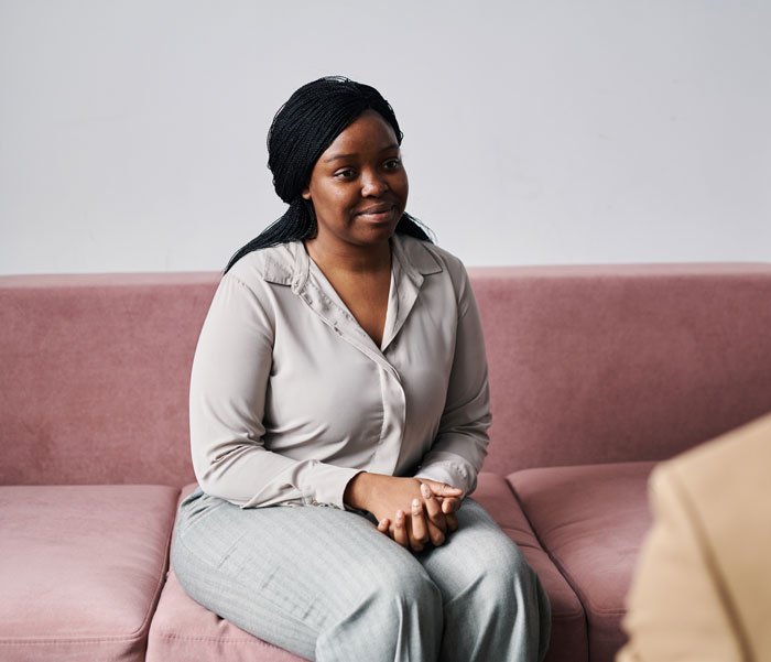 Woman on couch receiving therapy for eating disorders in Edmonds, WA