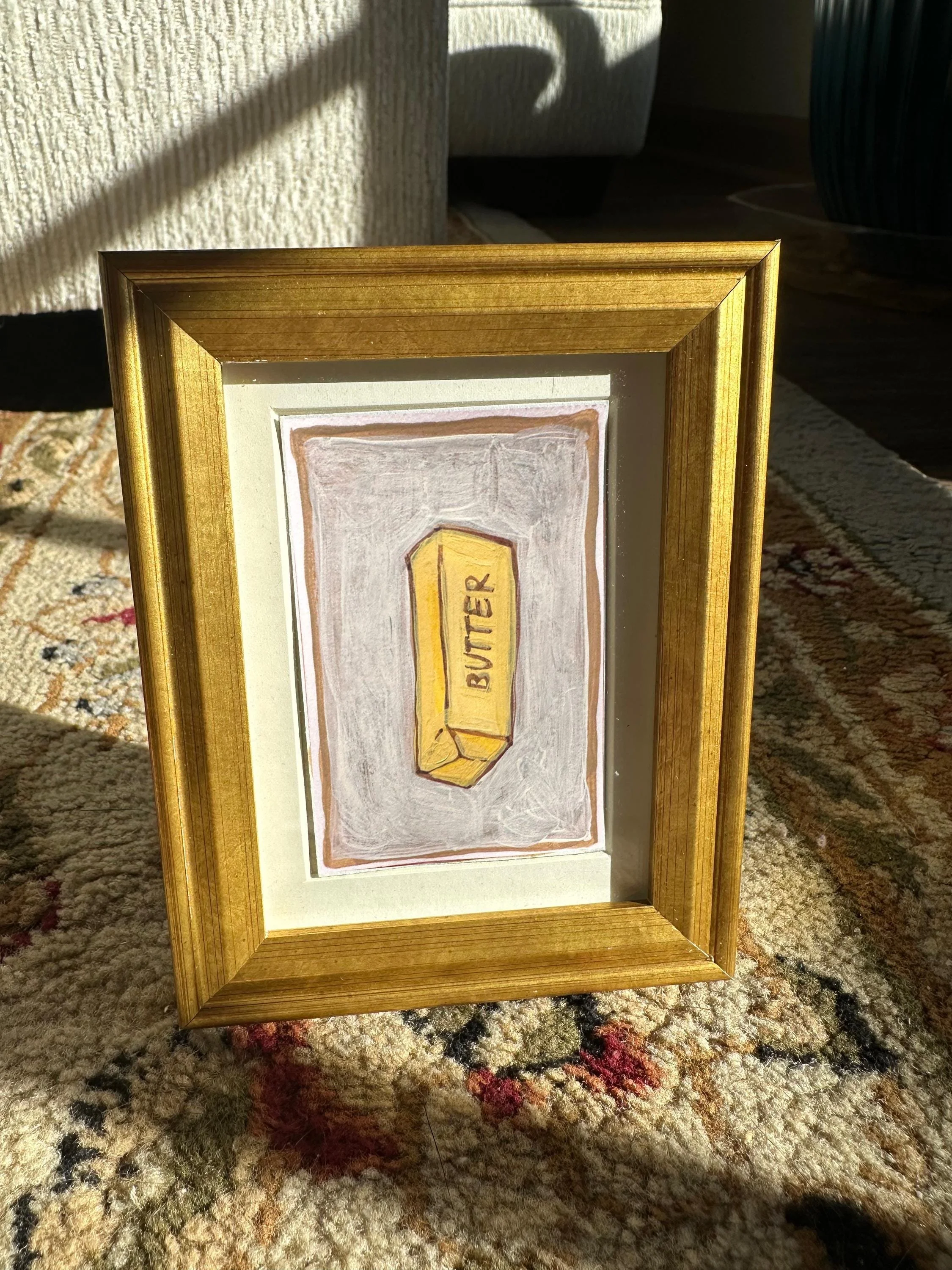Vintage butter-themed art print with retro design elements.
