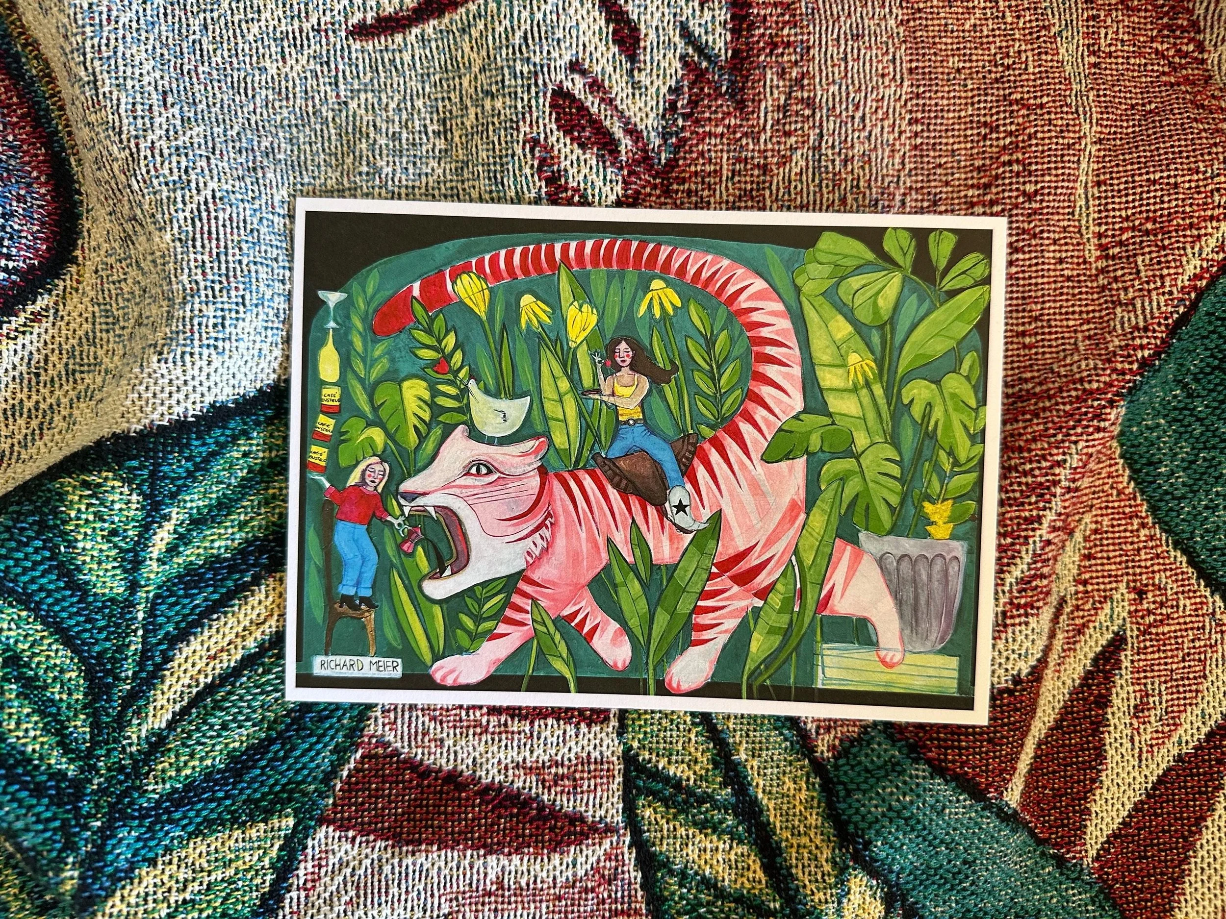 Funky painting of a pink tiger surrounded by plants and two female roommates.