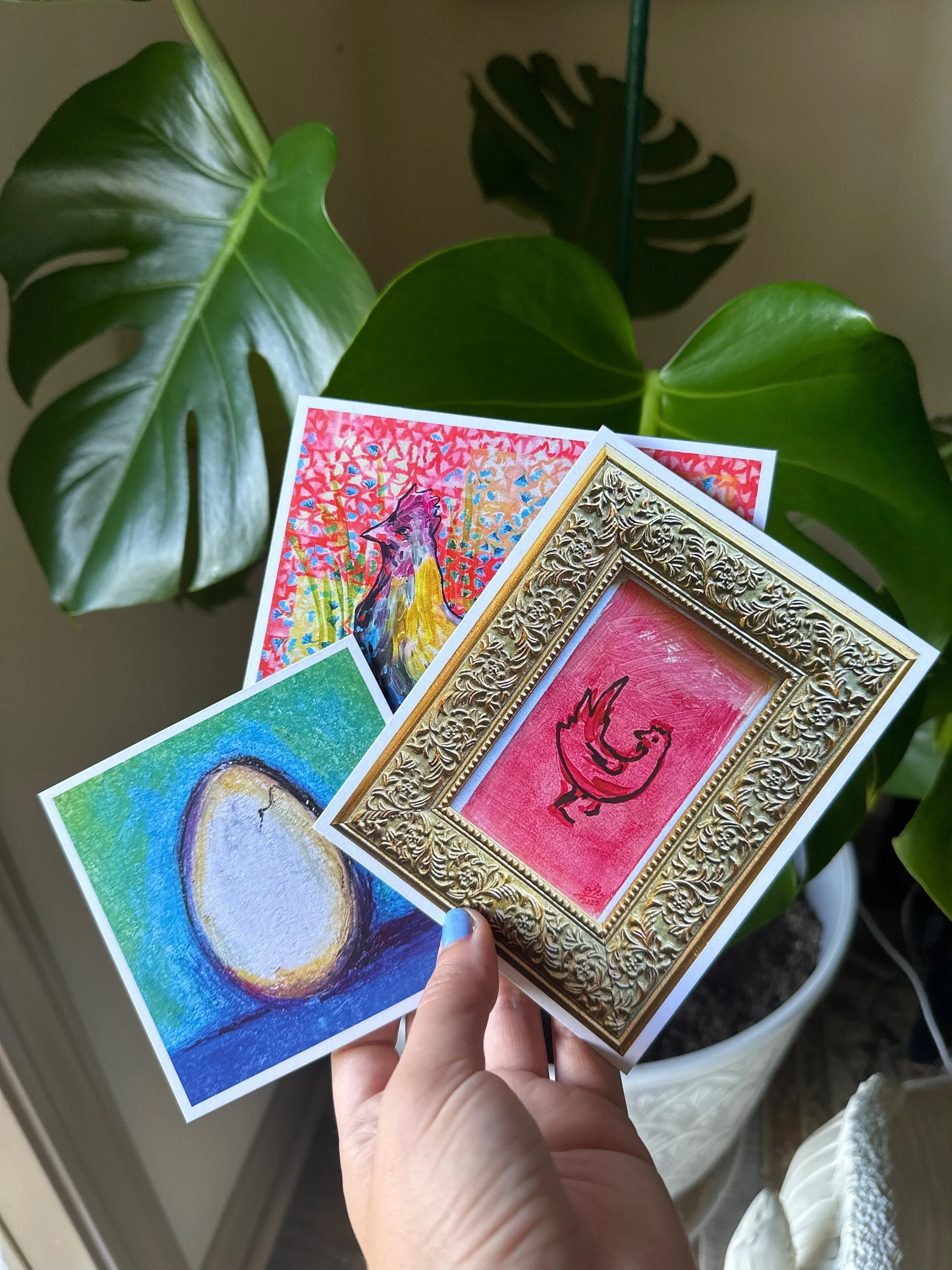 Set of paintings featuring a chicken and an egg with playful, bright colors.