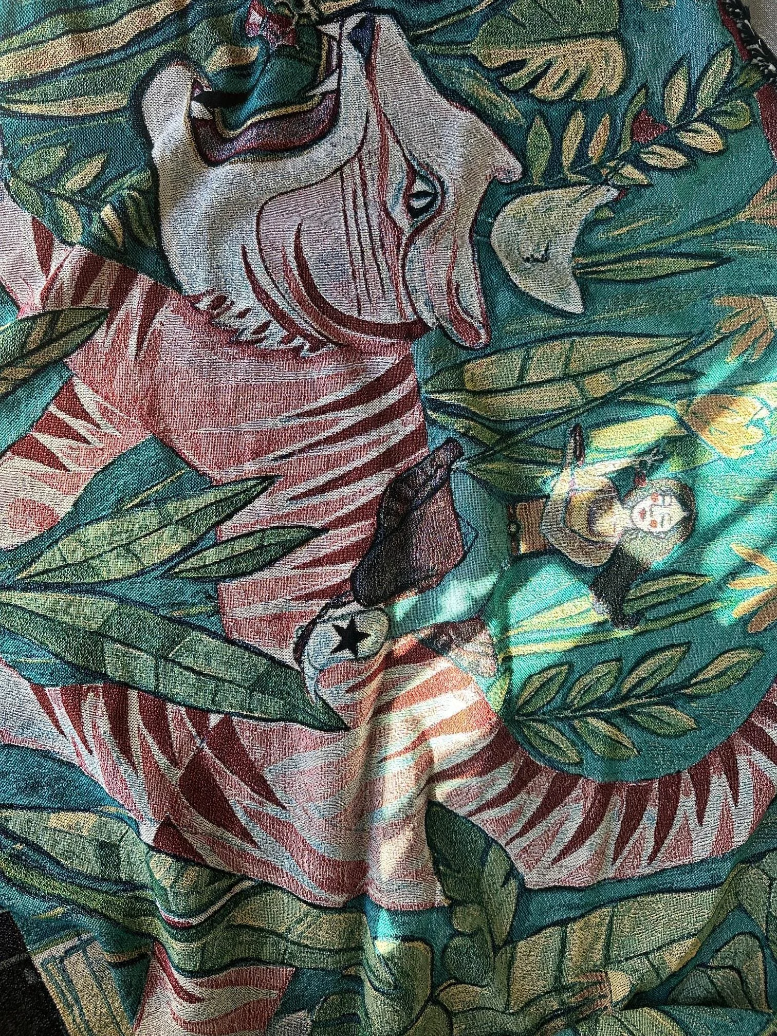Large tapestry featuring a tiger, roommates, and plants in a vibrant painting.