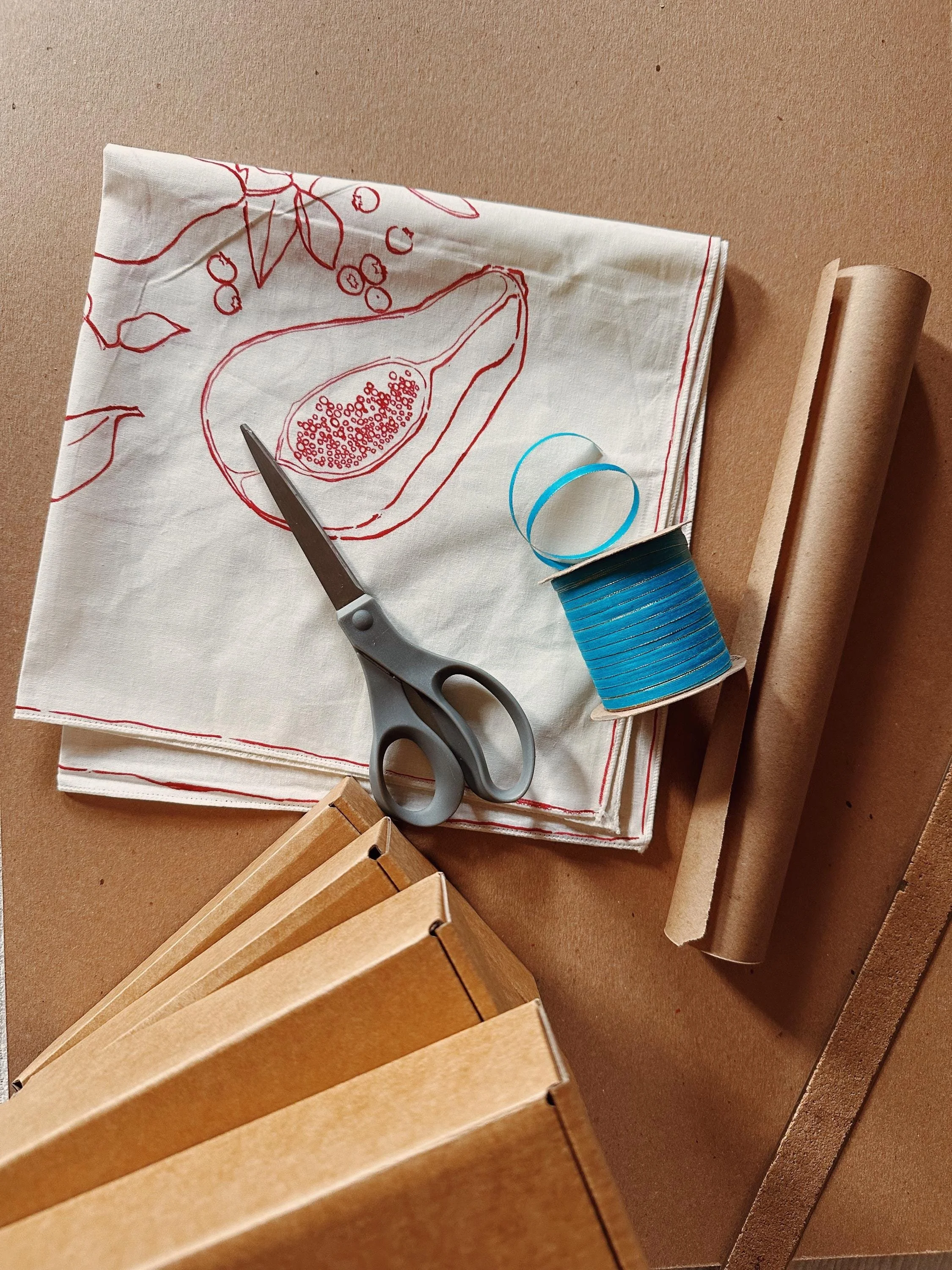 White hand-painted bandana with red fruit illustrations.