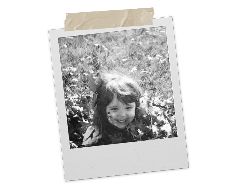 “Polaroid photograph in black and white showing Erin as a young child.”