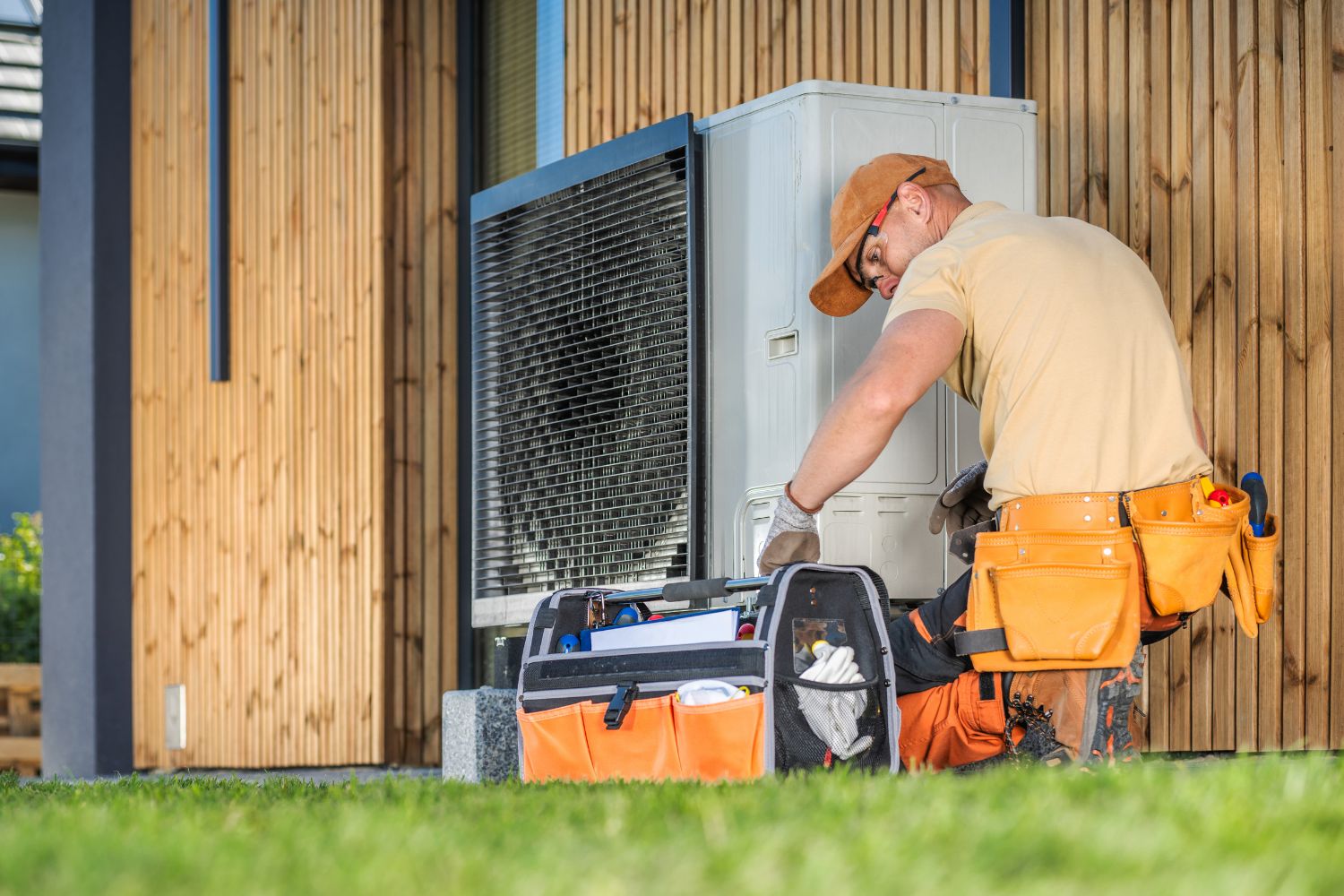 image of a technician working on a heating system.