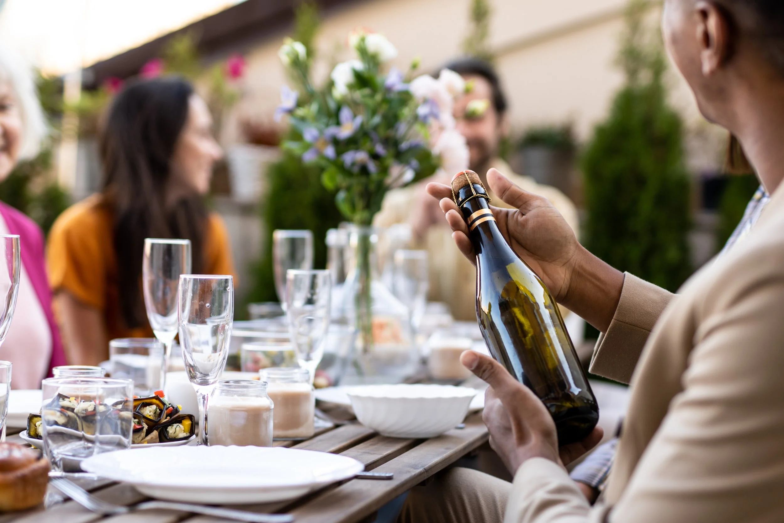 family-and-friends-celebrating-at-dinner-on-a-roof-2025-03-13-02-47-43-utc.jpg