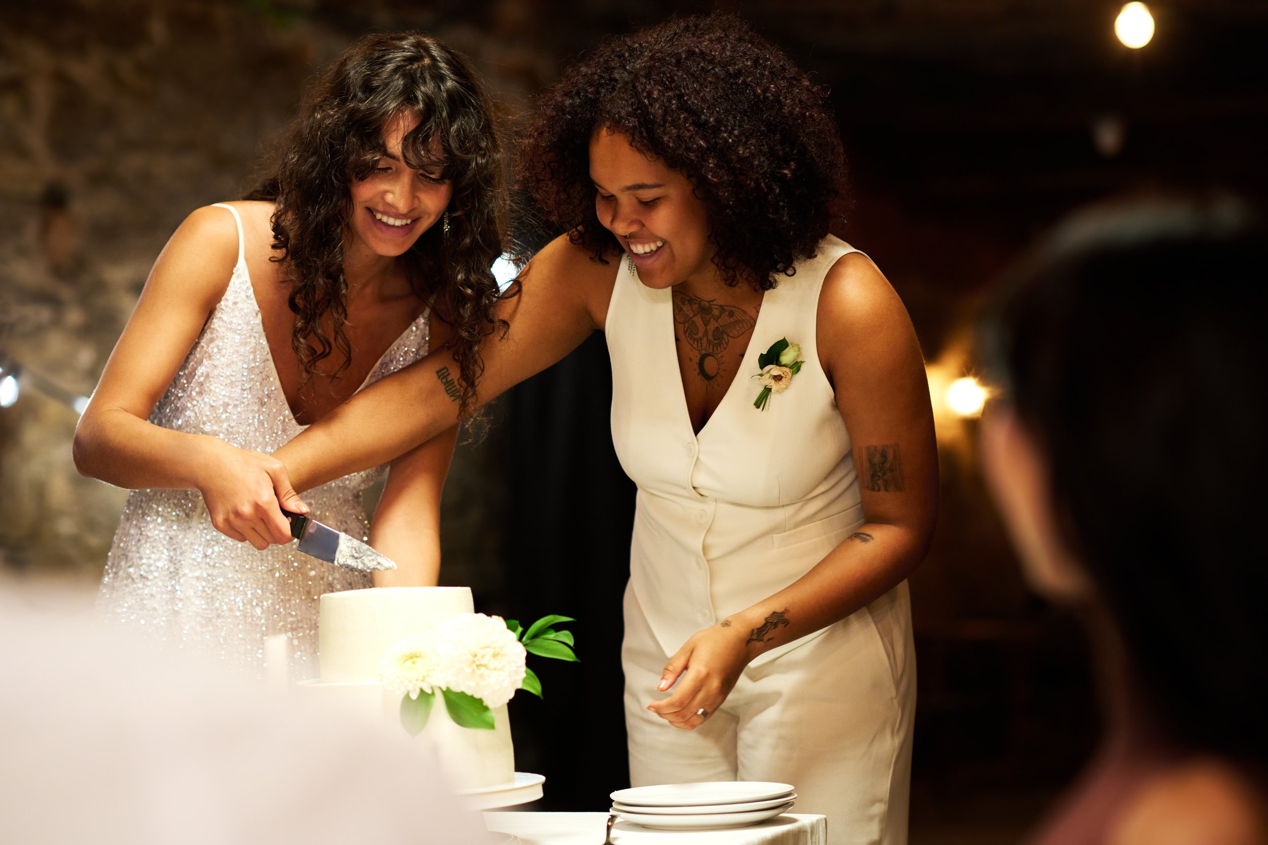 two-young-cheerful-brides-in-elegant-wedding-attir-2025-03-14-15-33-56-utc.jpg