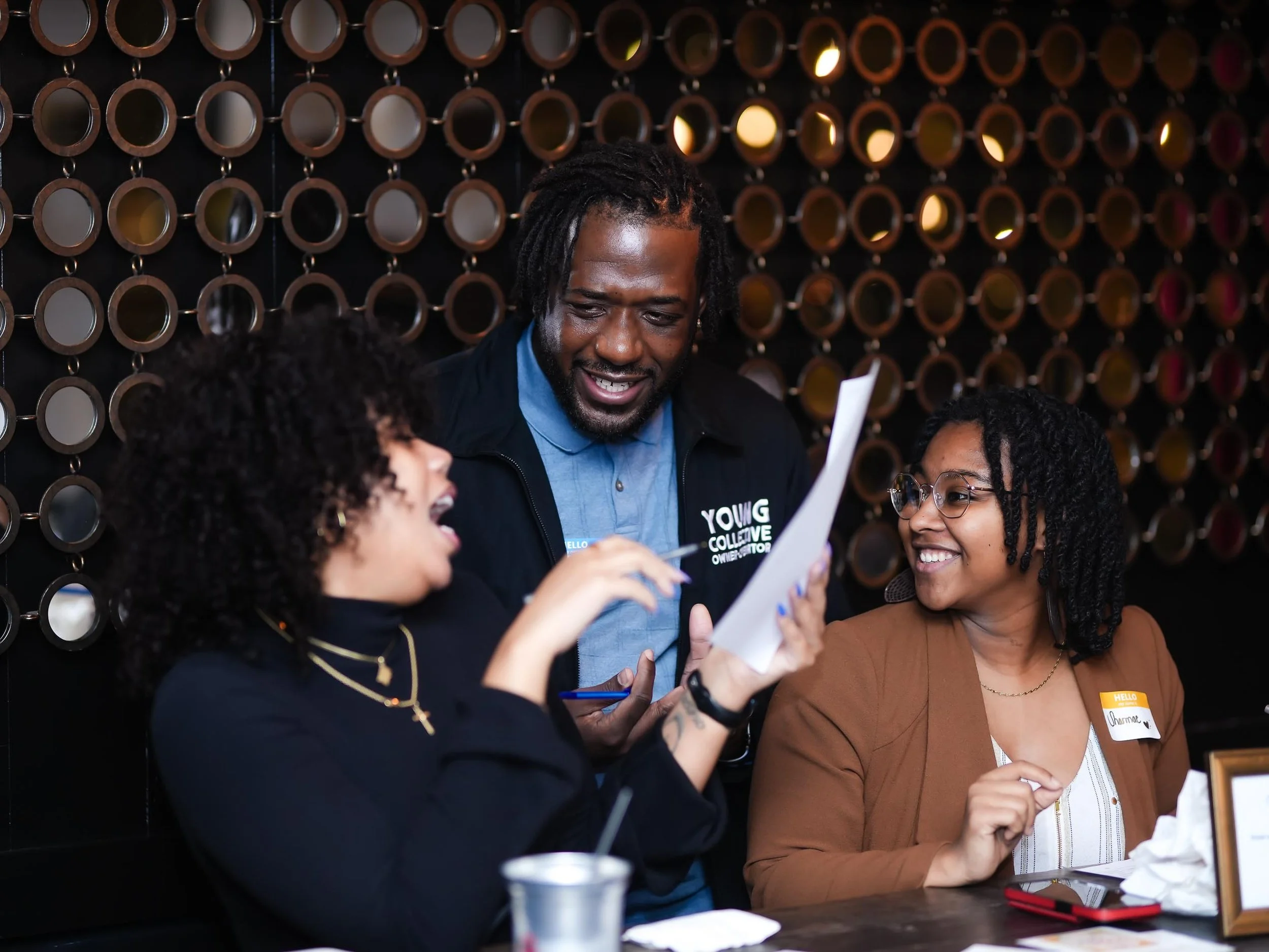 Three healthcare professionals having a conversation at Threshold Social Align & Connect Event