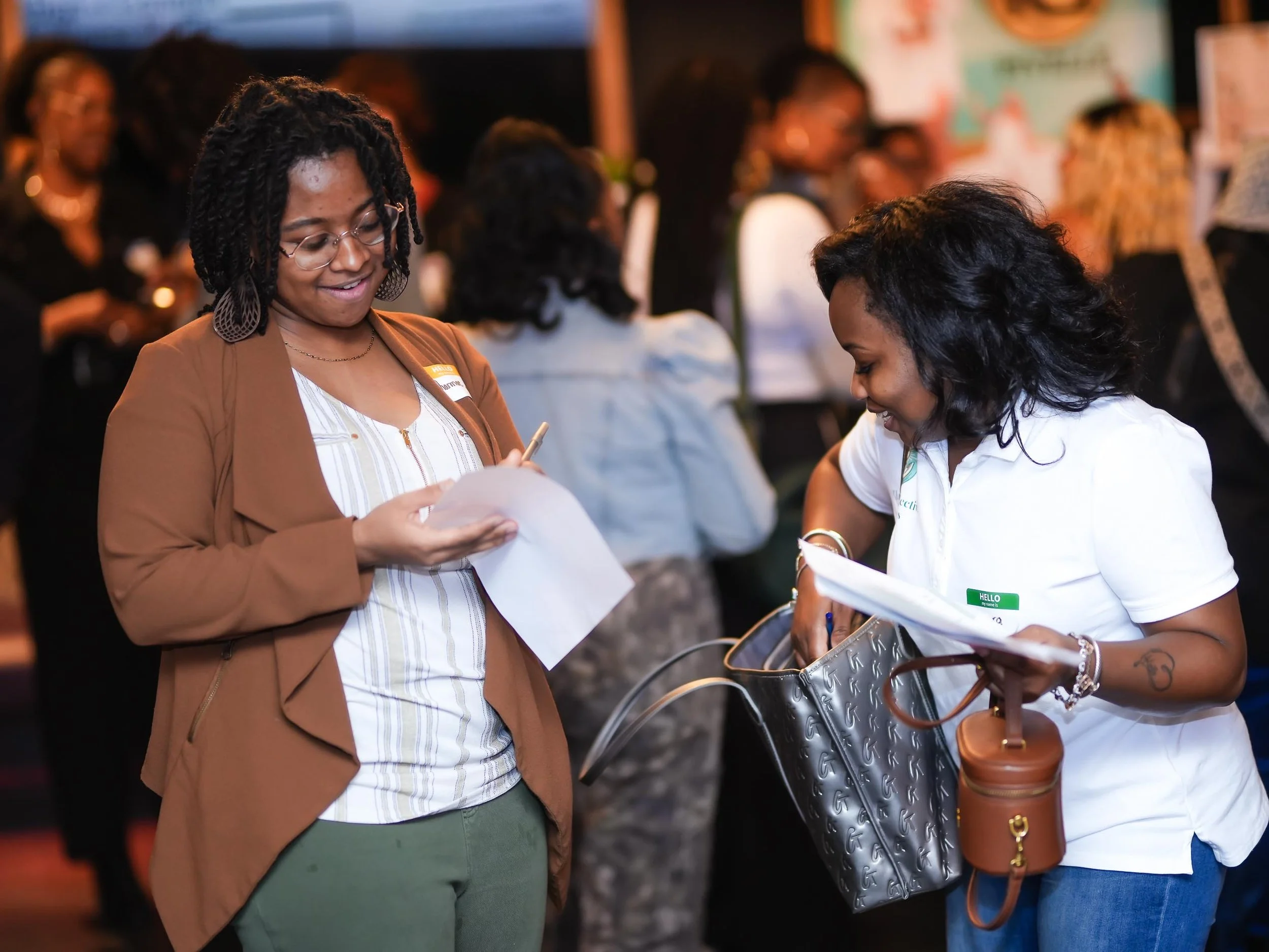 Three healthcare professionals having a conversation at Threshold Social Align & Connect Event